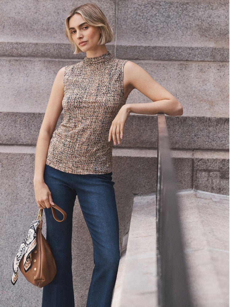 Sleeveless mock neck tank in a tan, brown, and black tweed knit.