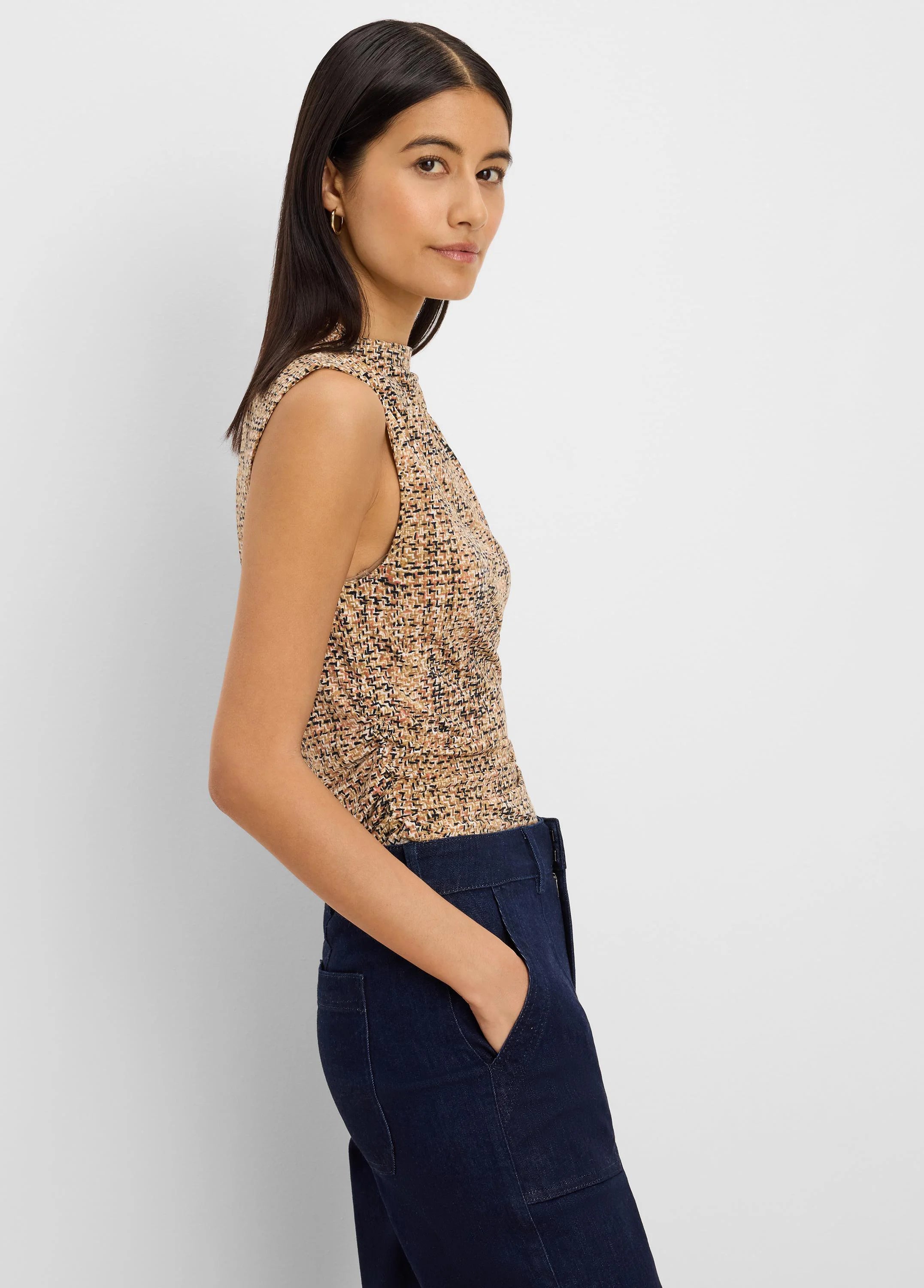 Sleeveless, high-neck tweed knit tank. Multi-color print with beige, black, and rust threads.
