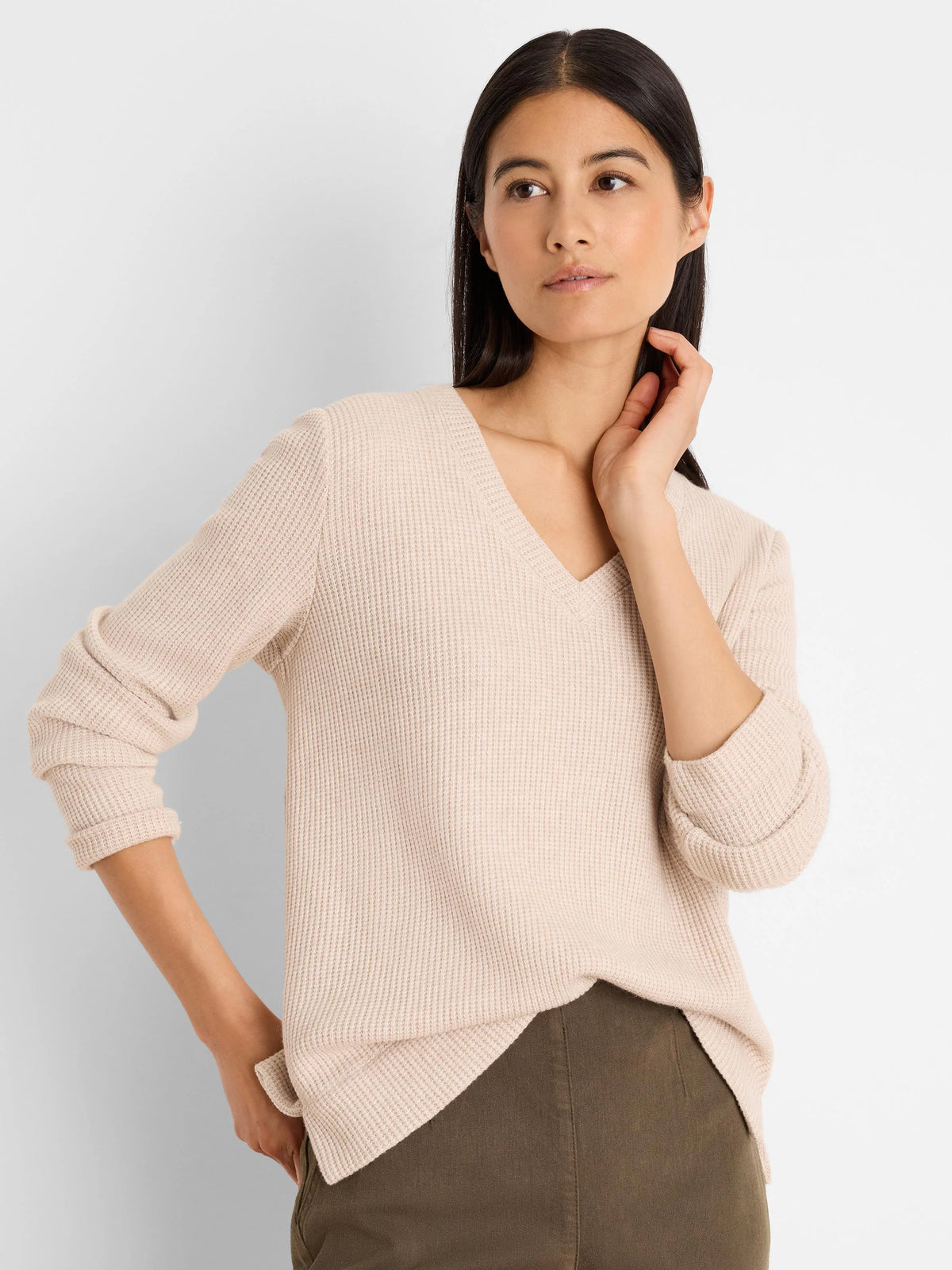 Pale beige waffle knit thermal top with a V-neck and long sleeves.