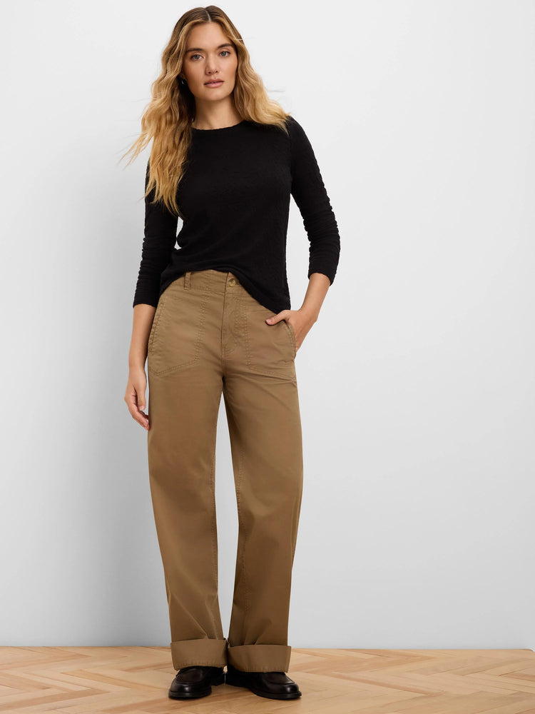Black long-sleeve top with a round neckline and visible crinkle knit texture.