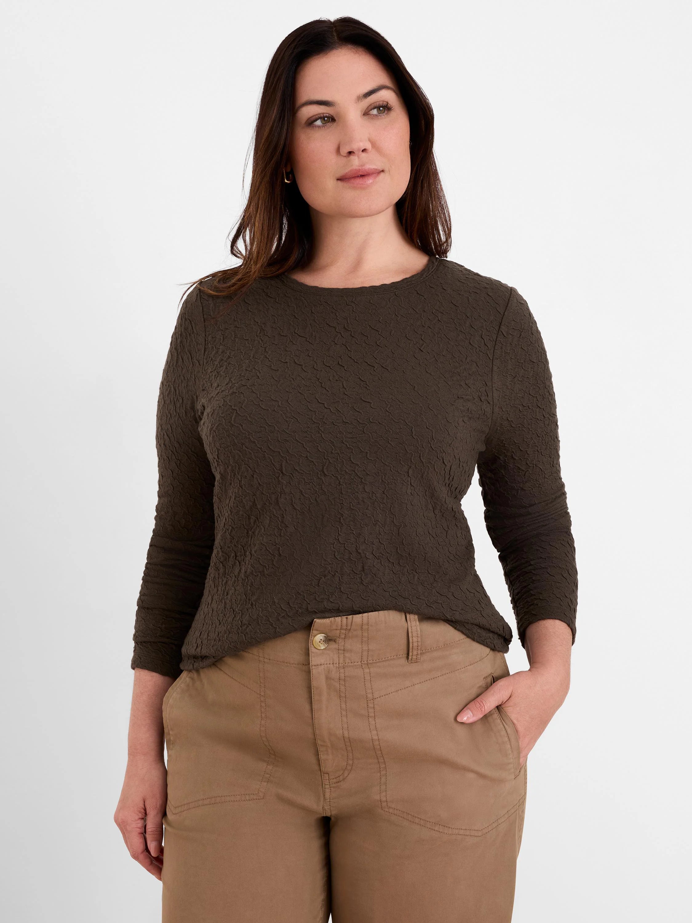 Dark brown crinkle knit top with an all-over puckered texture, 3/4 sleeves, and a round neckline.