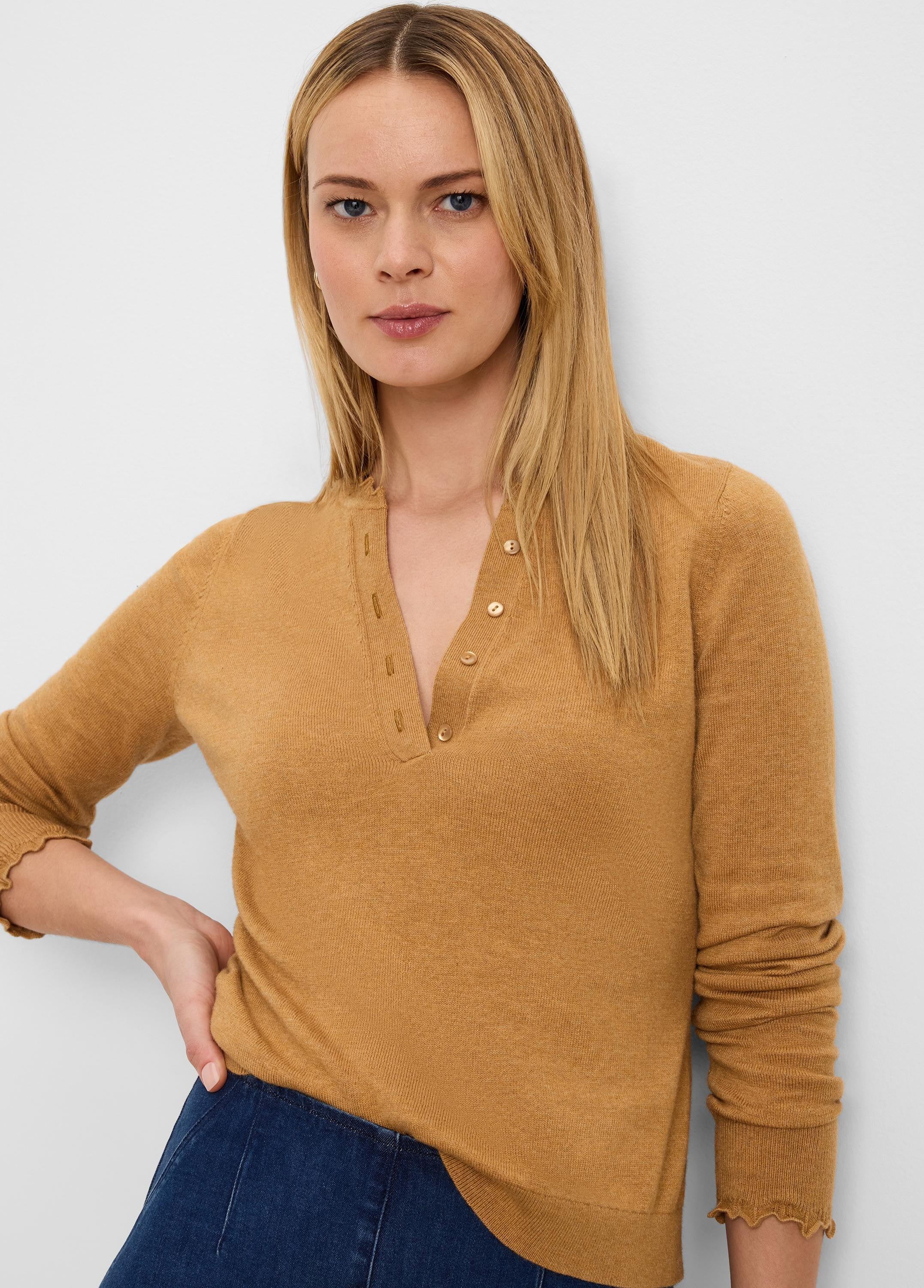 Camel Henley sweater with a 3-button placket and ruffle-edged 3/4 length sleeves.