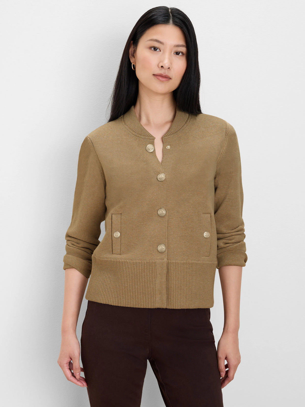 Tan knit bomber jacket with gold snap closure, two snap patch pockets, ribbed collar & hem.