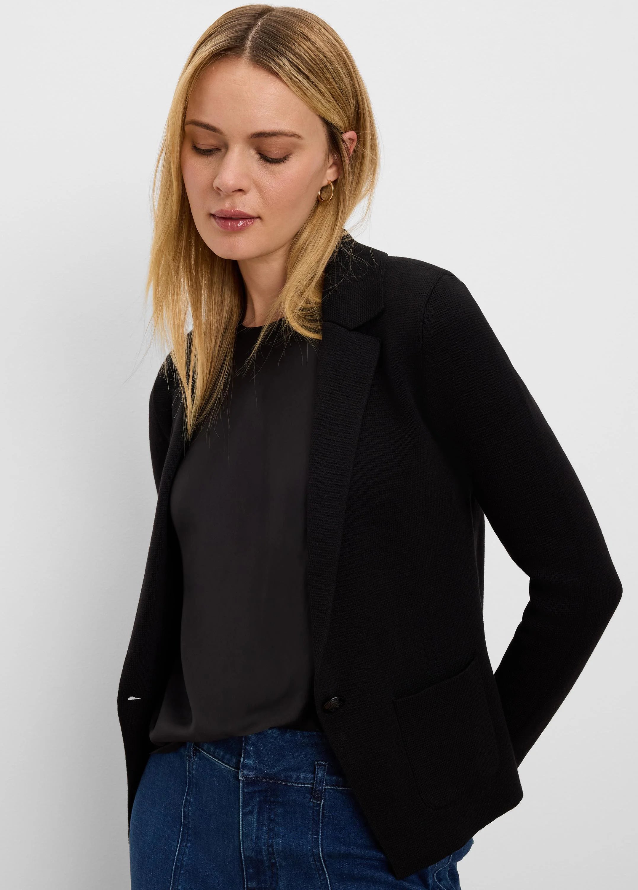 Black knit tailored blazer with lapel collar, single button closure, and front patch pockets.