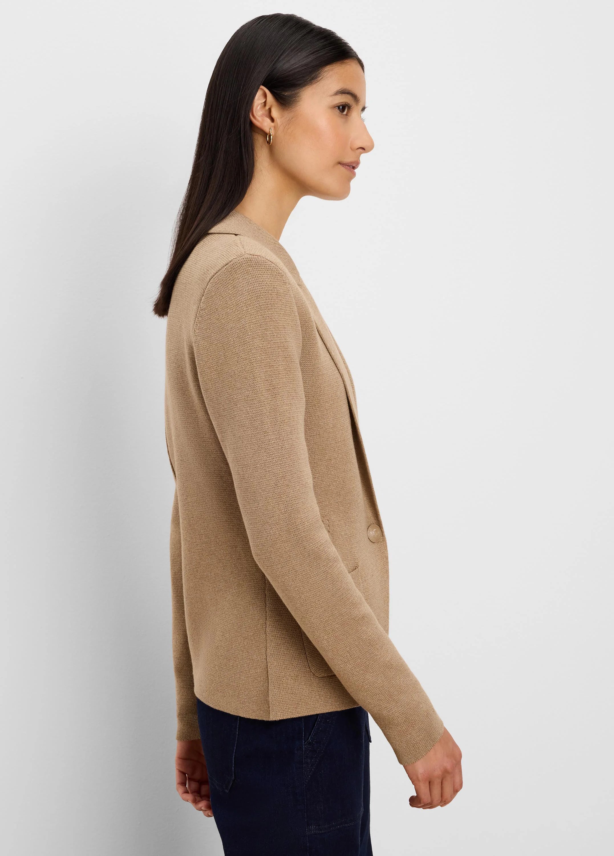 Camel knit blazer with notched lapels, one button, and a patch pocket, worn by a woman.
