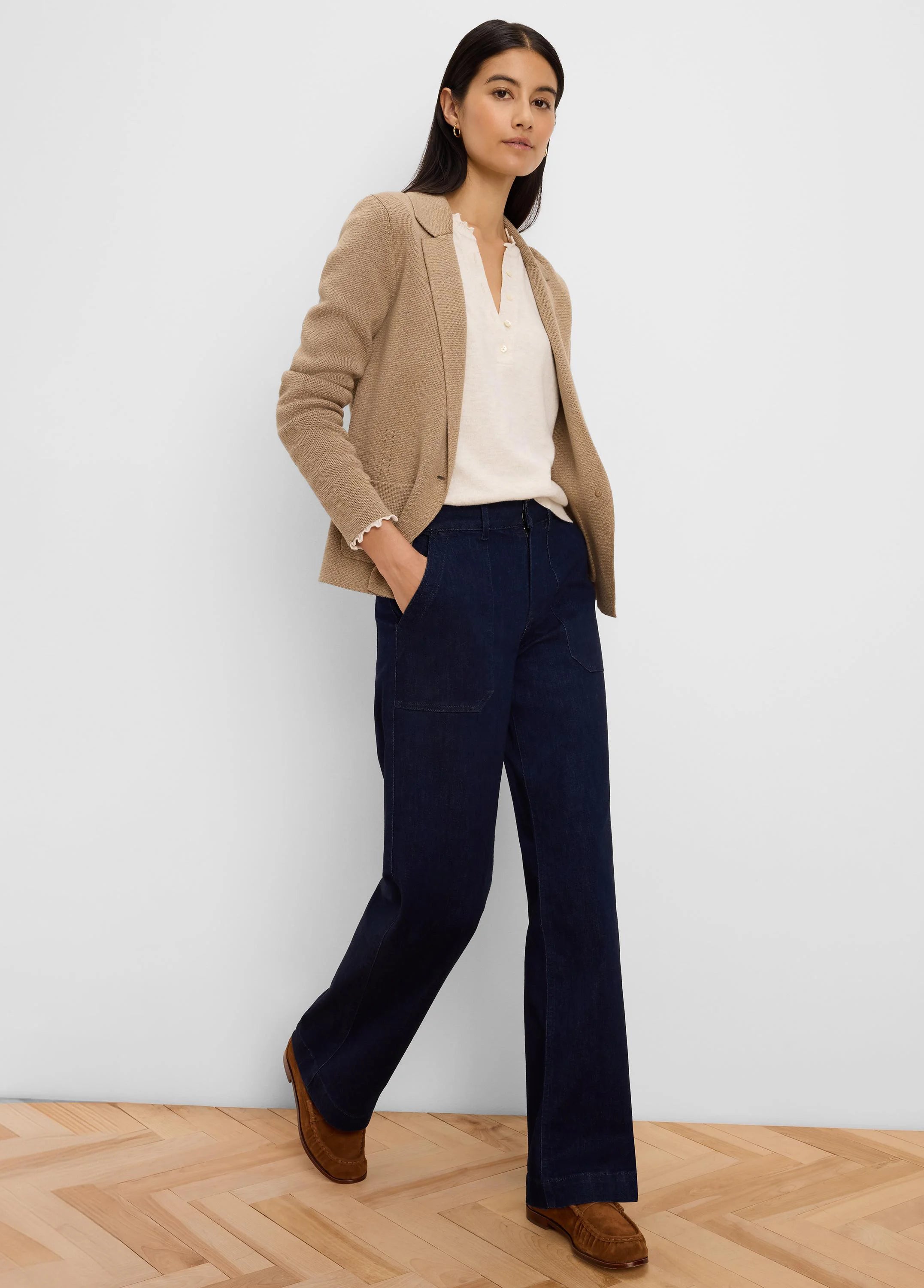 Tan knit tailored blazer with notched lapels and front patch pockets.