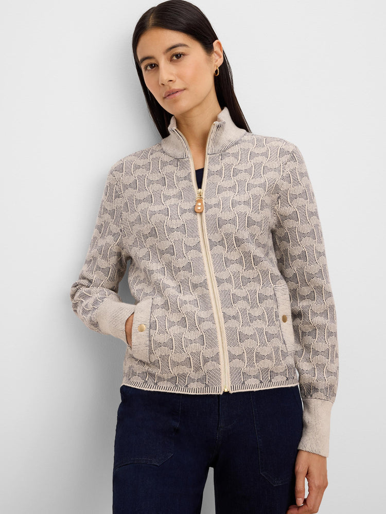 Cream knit jacket with dark grey swirl pattern. Features gold full-zip, stand collar, ribbed cuffs & hem, and gold-button...