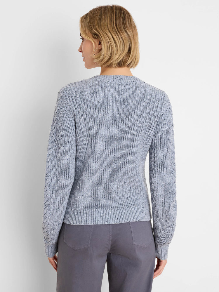Light blue flecked shaker knit sweater with cable textured sleeves.