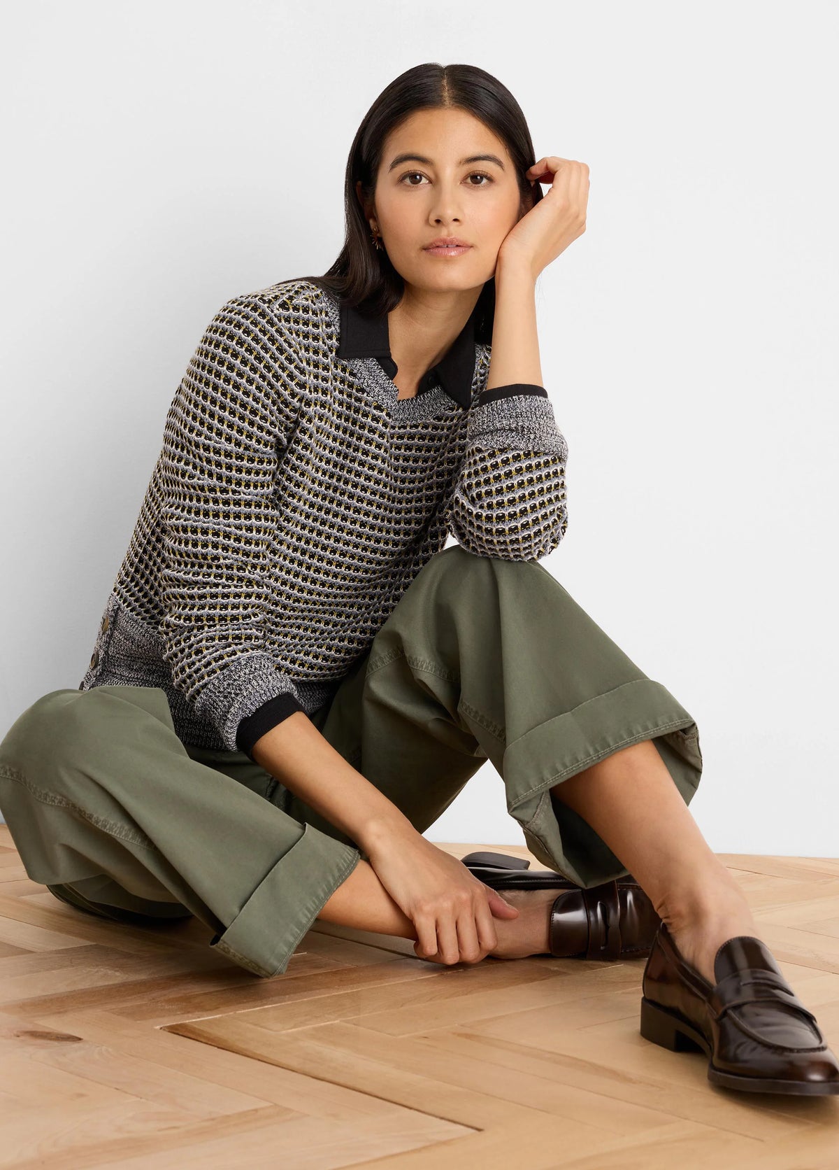 Black, grey, yellow marled sweater with open grid knit, black polo collar, and long sleeves.