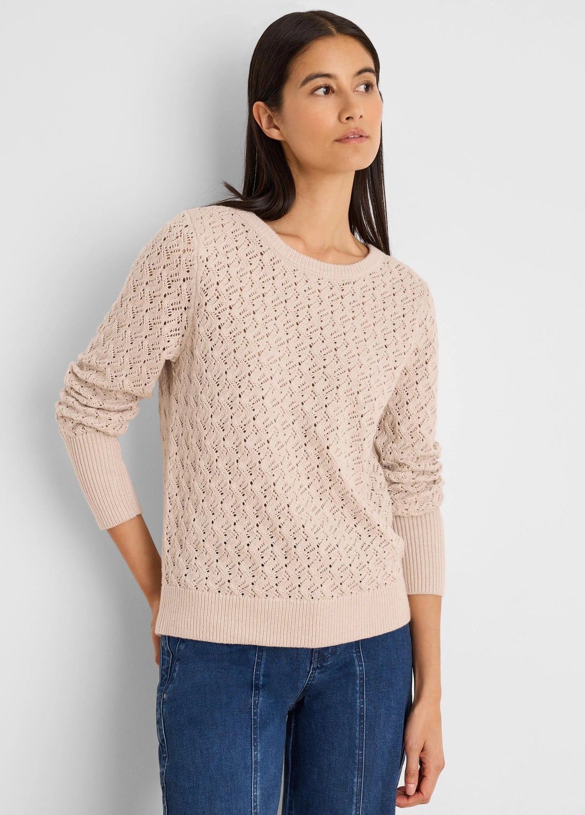 Light beige openwork sweater with a diamond stitch pattern. Features ribbed cuffs, hem, and a round neckline.