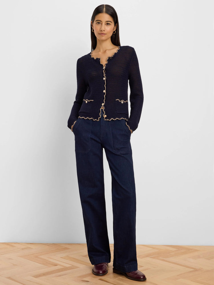 Navy mesh cardigan with scalloped beige trim, light buttons, and two front pockets.