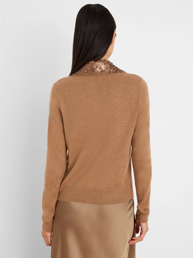 Back view of a tan knit cardigan with a bronze sequin collar.