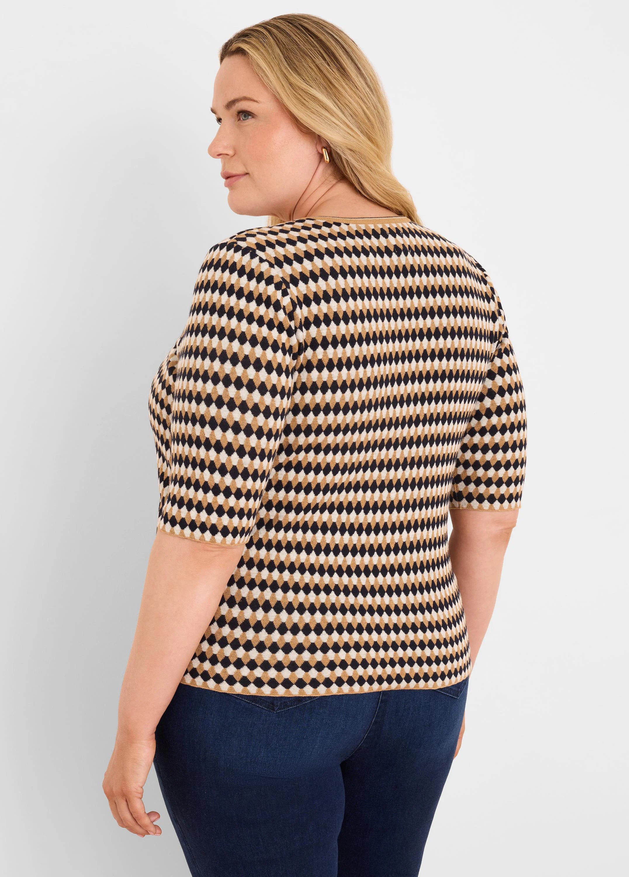 Black, tan, and cream angled jacquard sweater with elbow-length sleeves.