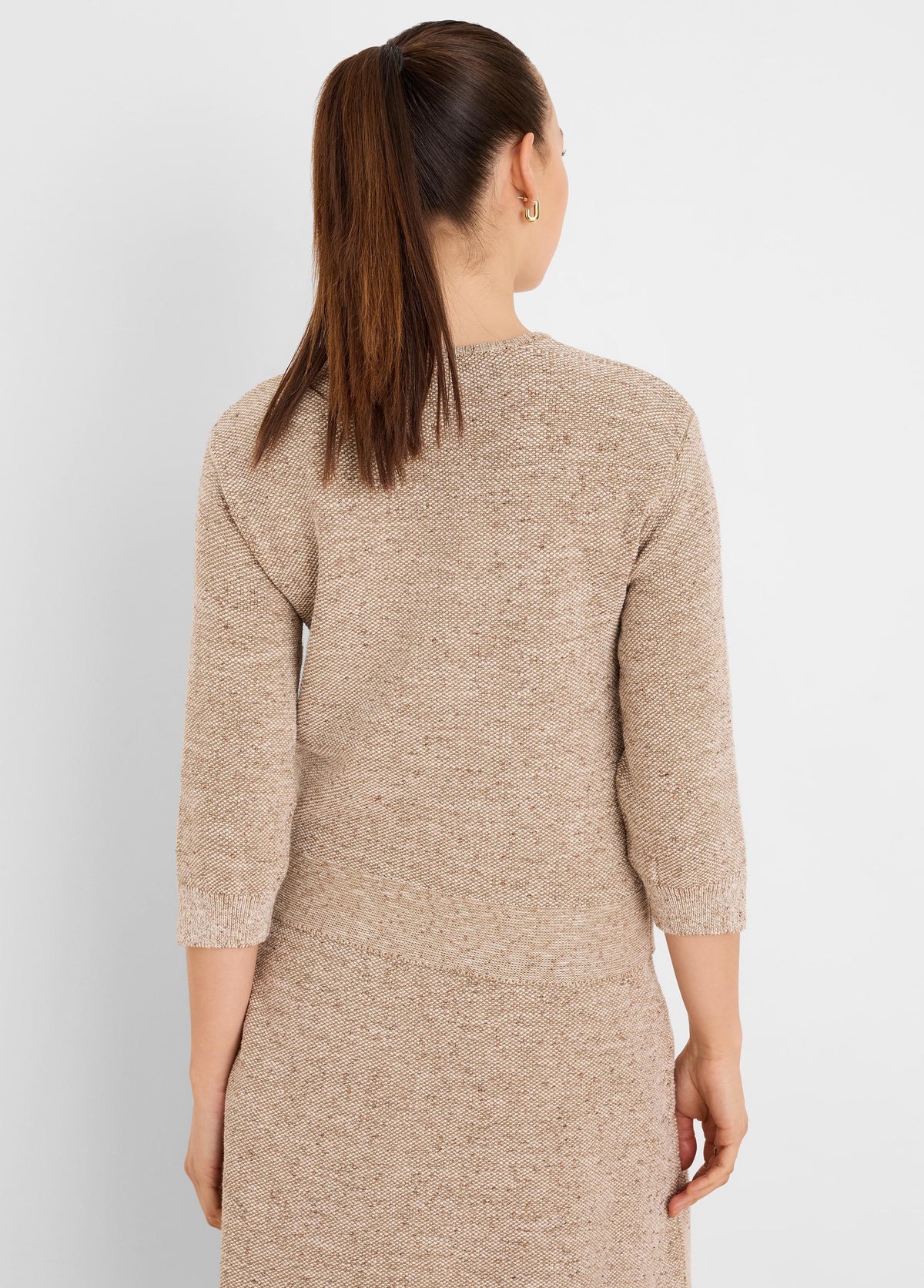 Multi-tonal beige tweed sweater, back view, with 3/4 sleeves and ribbed cuffs and hem.