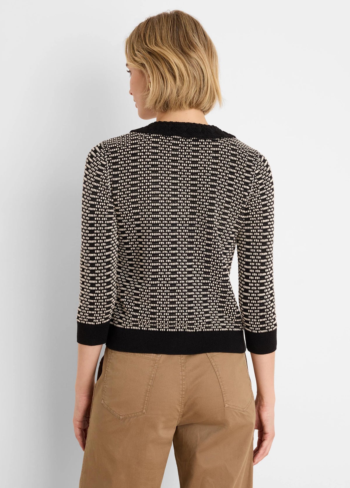 Black & cream geo stitch sweater with lace trim collar, 3/4 sleeves, shown from back.