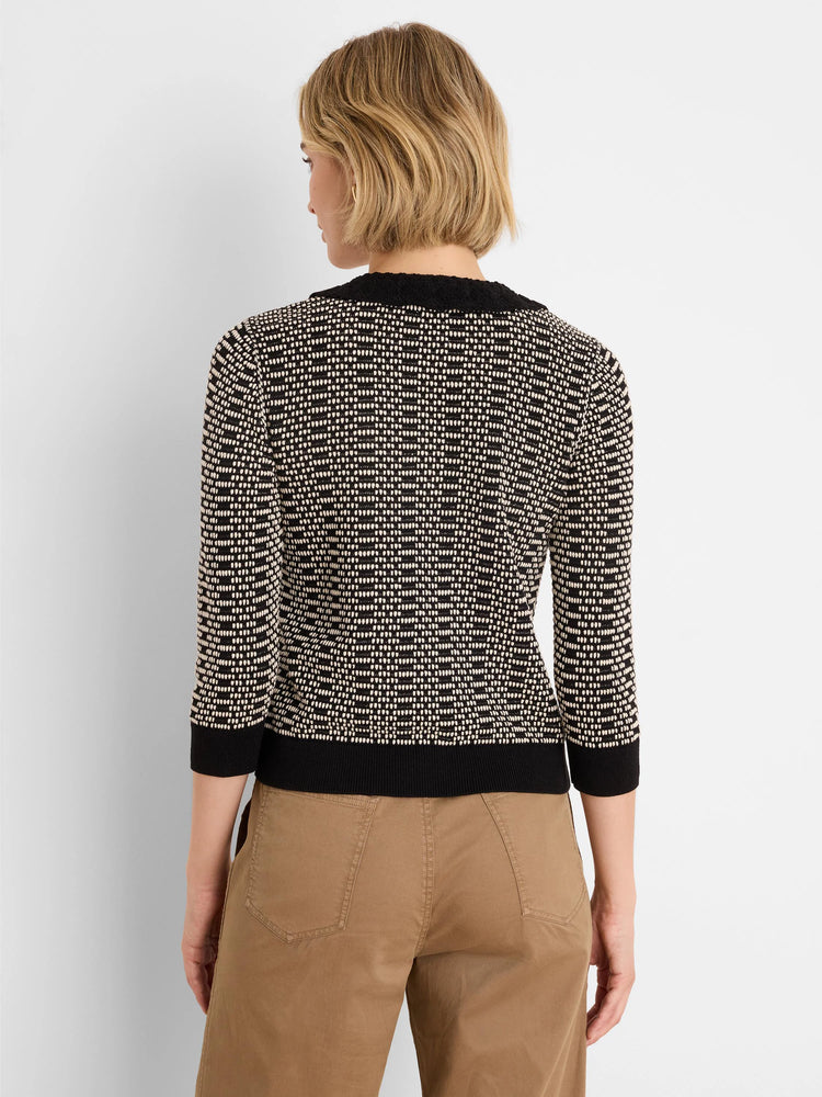 Black & cream geo stitch sweater with lace trim collar, 3/4 sleeves, shown from back.