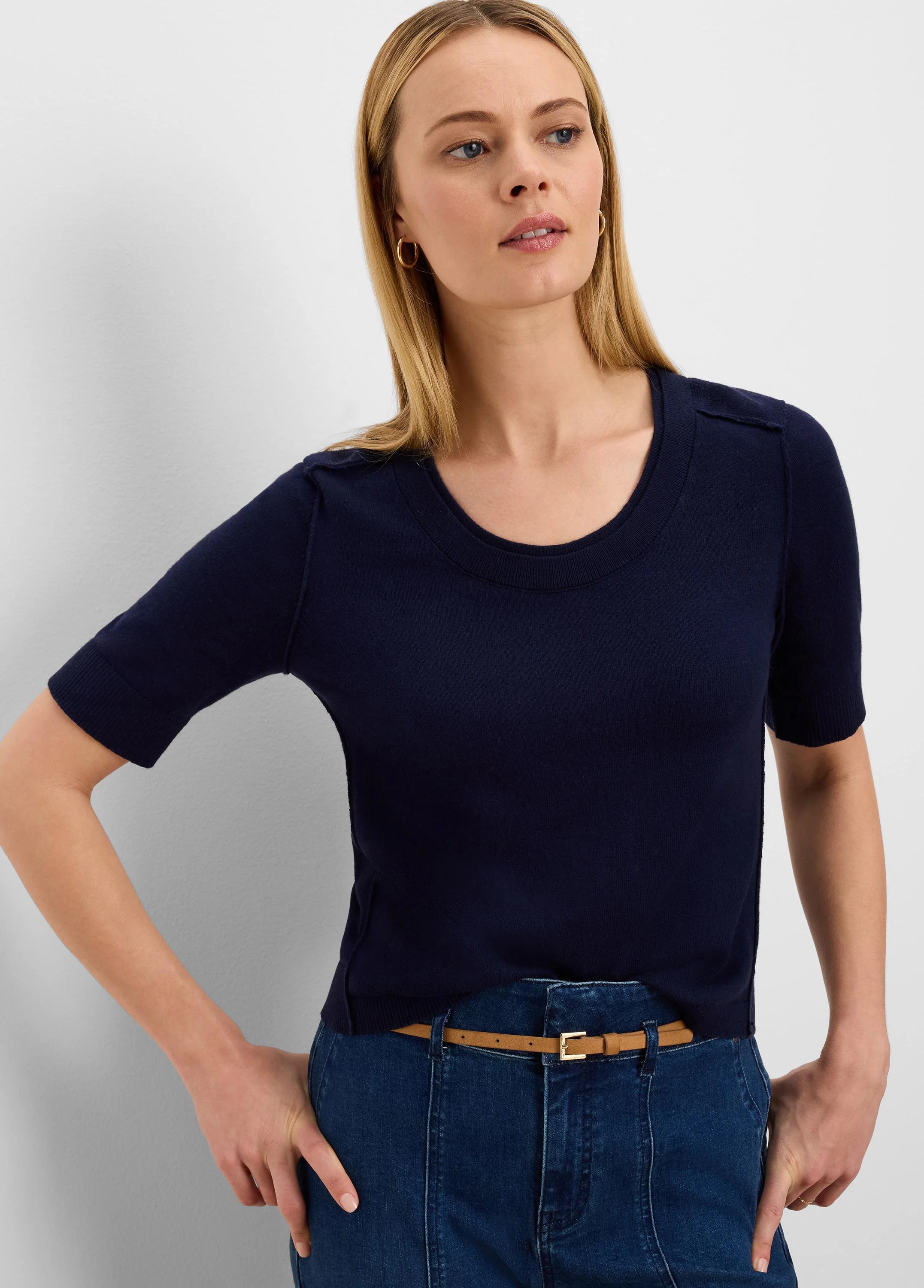 Navy pure cotton sweater tee with a scoop neck, short ribbed sleeves, and subtle decorative shoulder tabs.
