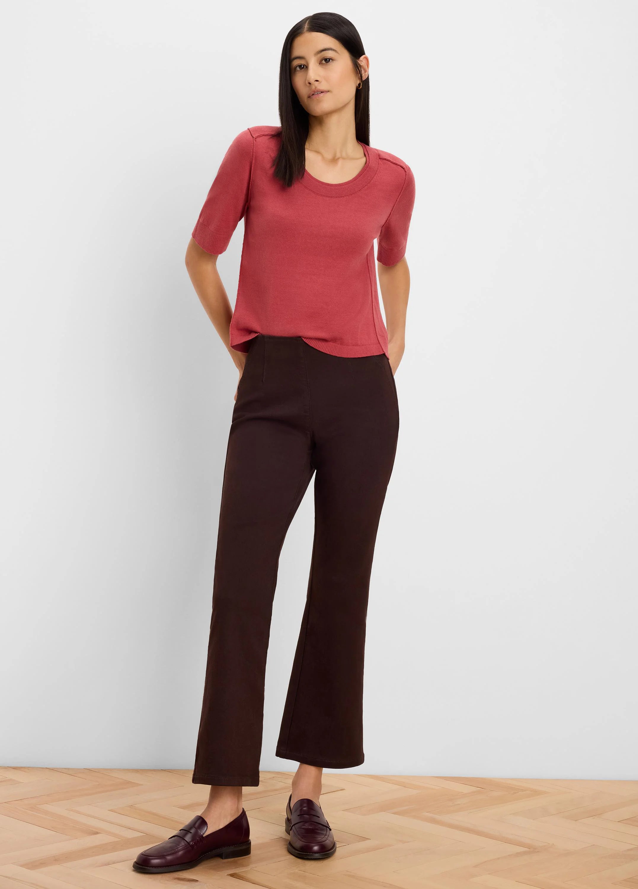 Terra cotta sweater tee with short sleeves, a crew neck, and visible seam details on the shoulders.