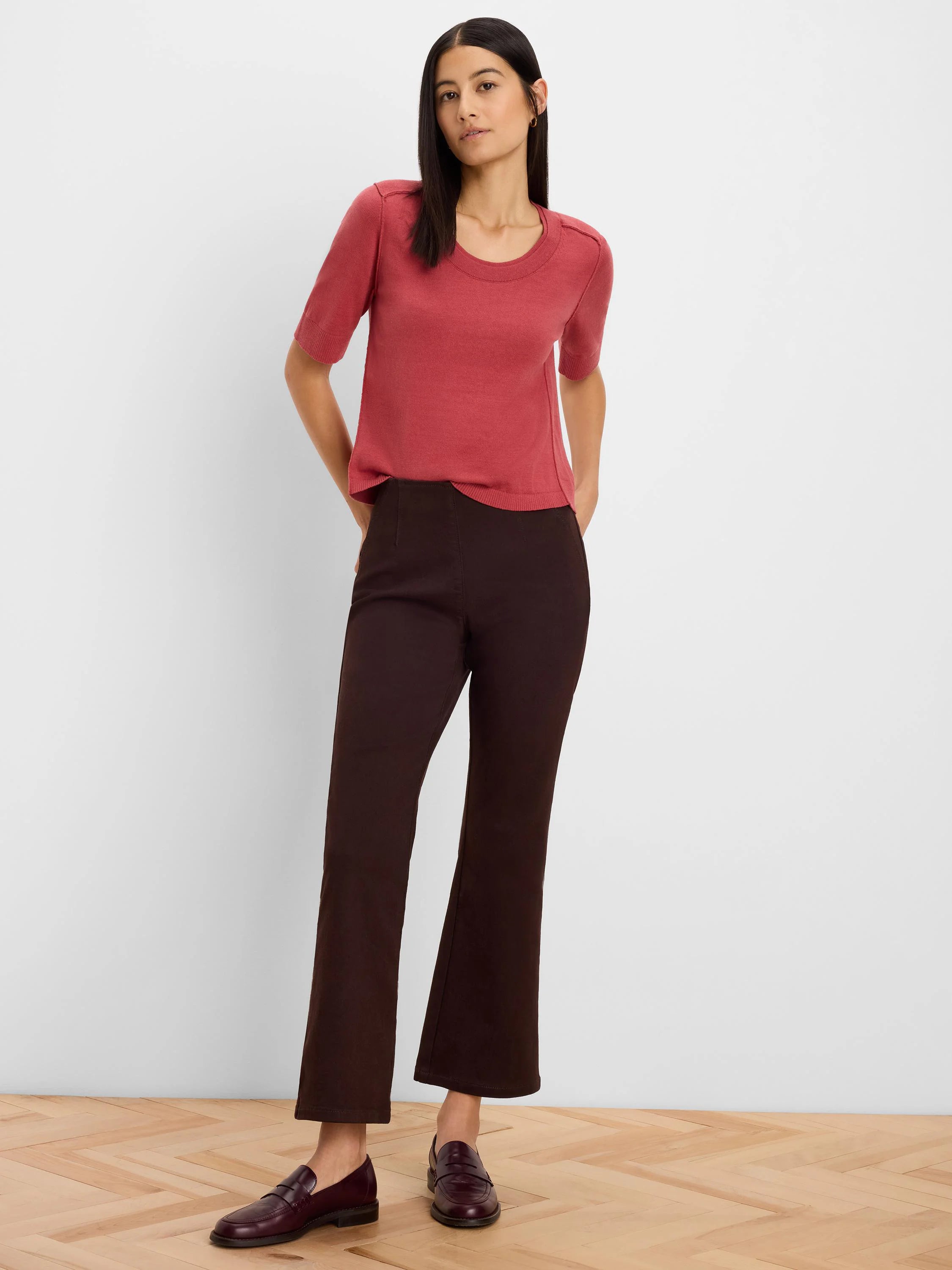 Terra cotta sweater tee with short sleeves, a crew neck, and visible seam details on the shoulders.