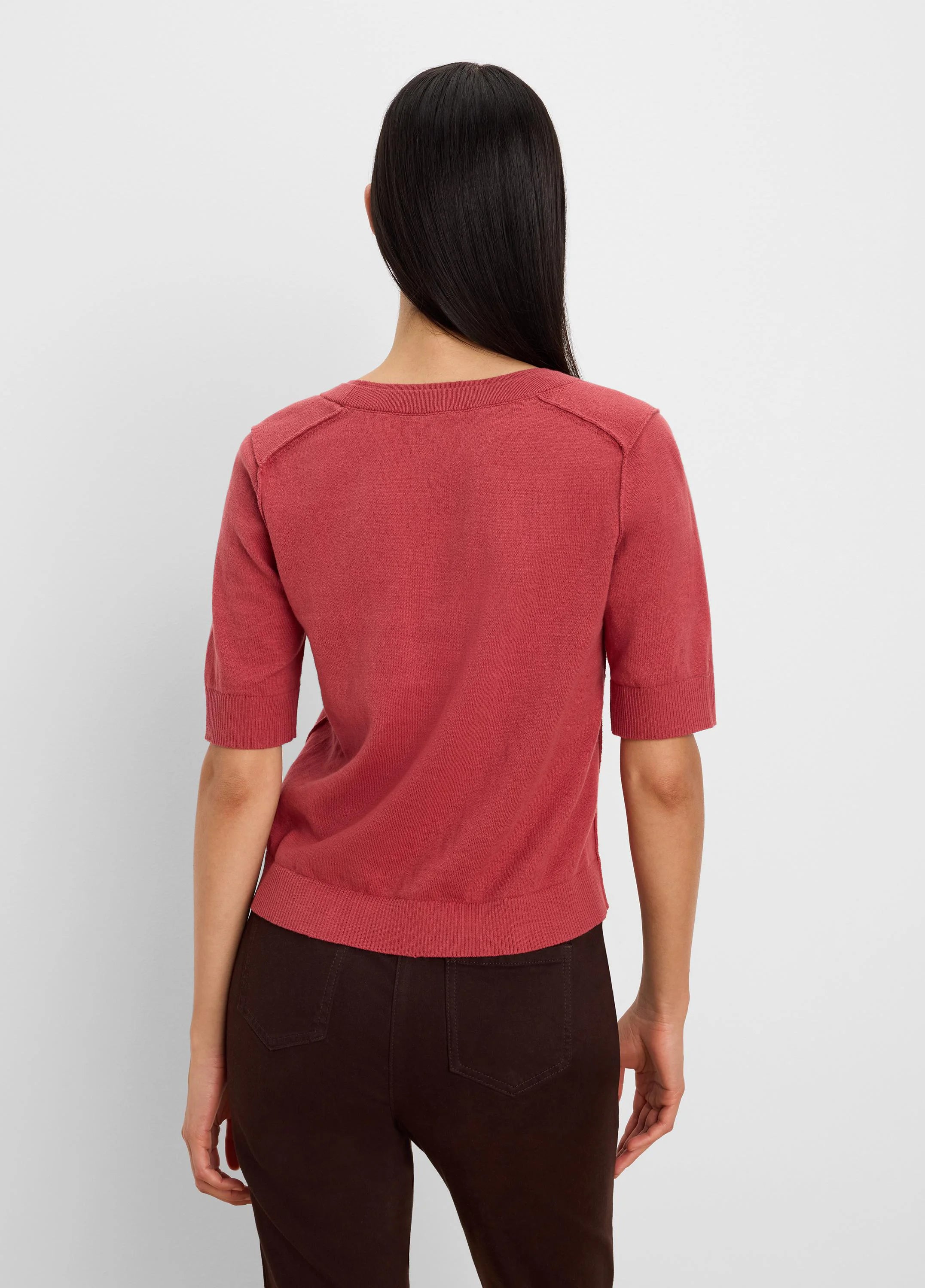 Rear view: Terracotta short-sleeve sweater tee with ribbed cuffs, hem, and a crew neck.