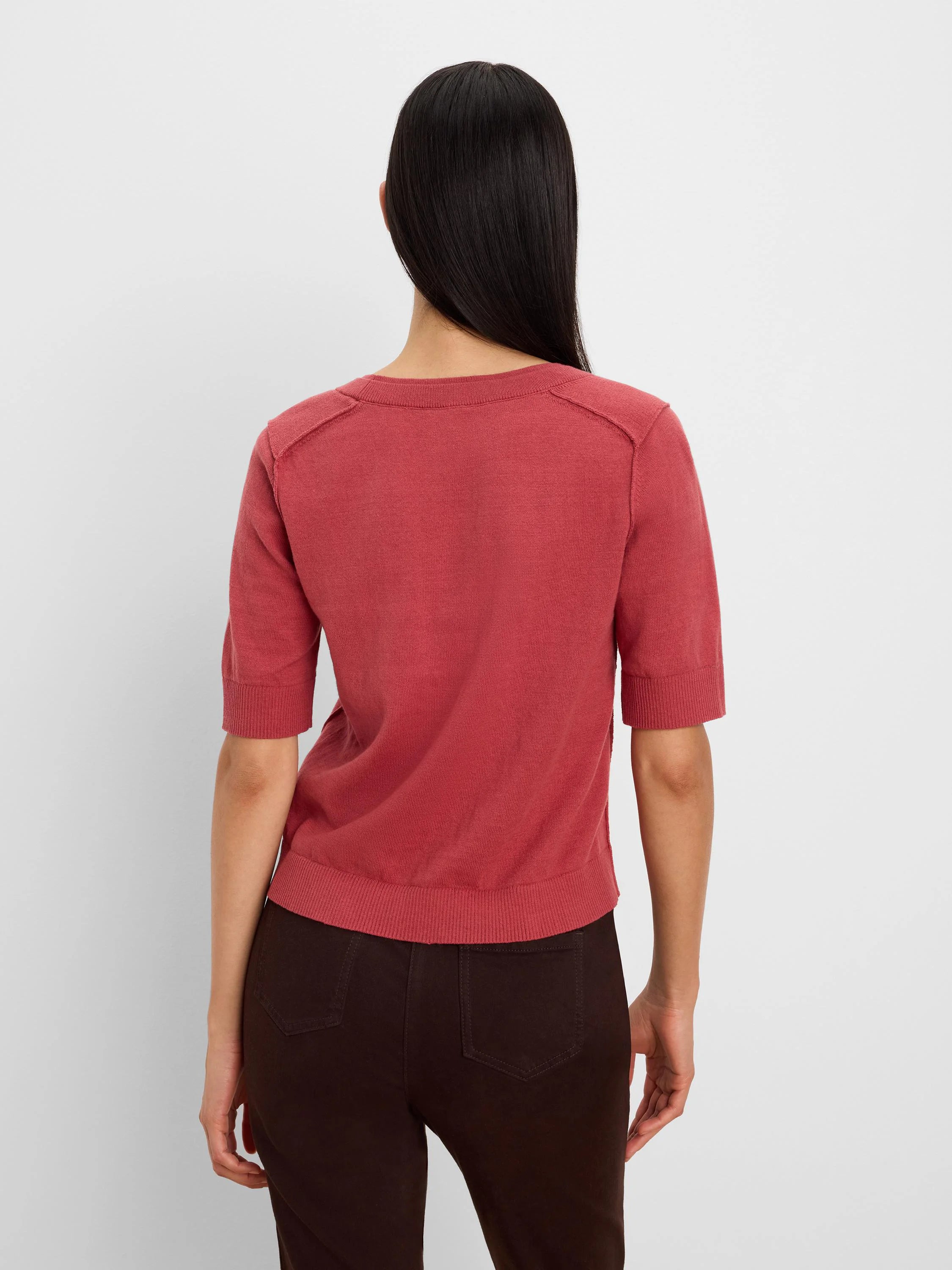Rear view: Terracotta short-sleeve sweater tee with ribbed cuffs, hem, and a crew neck.