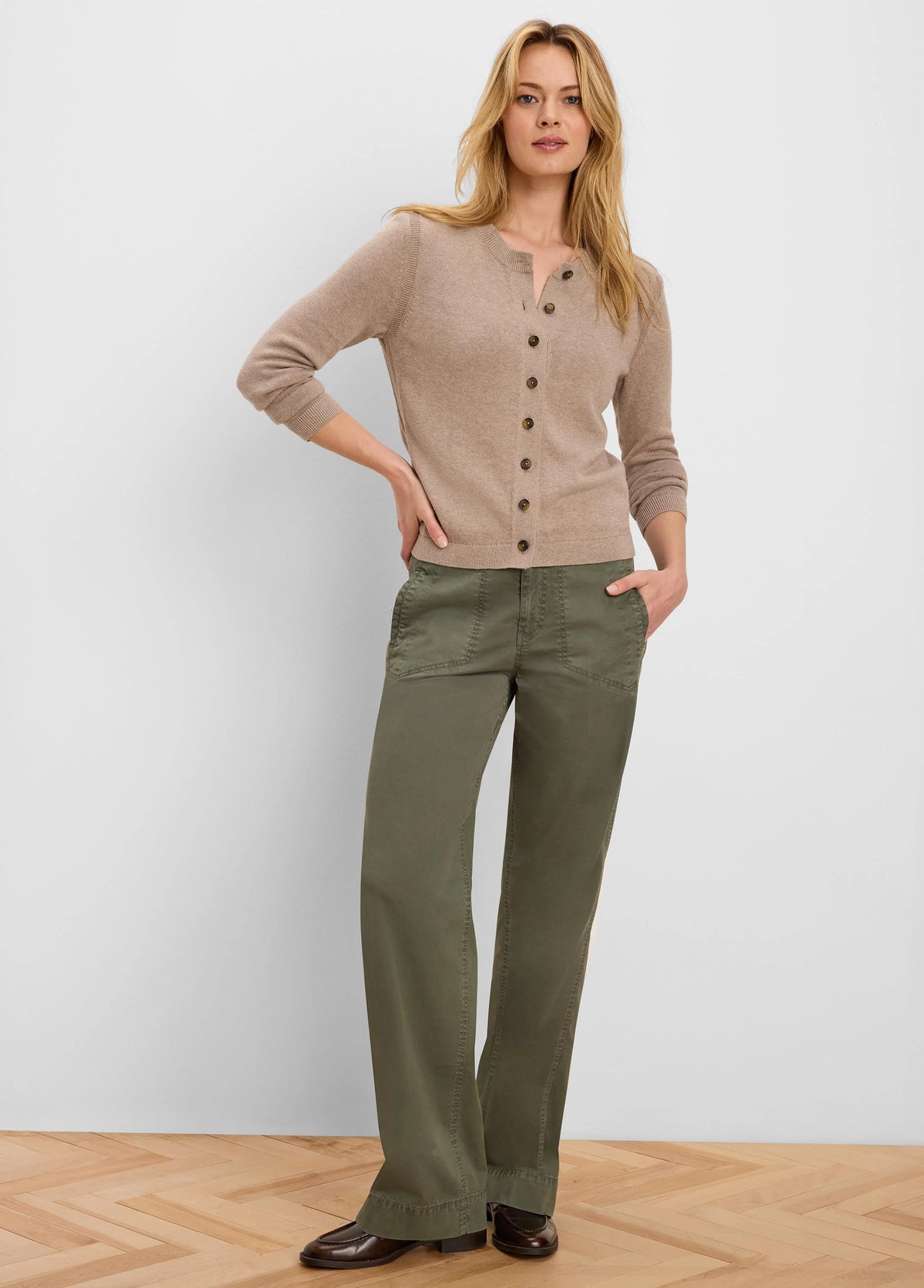 Beige button-up cardigan with dark brown buttons, ribbed cuffs, and hem.