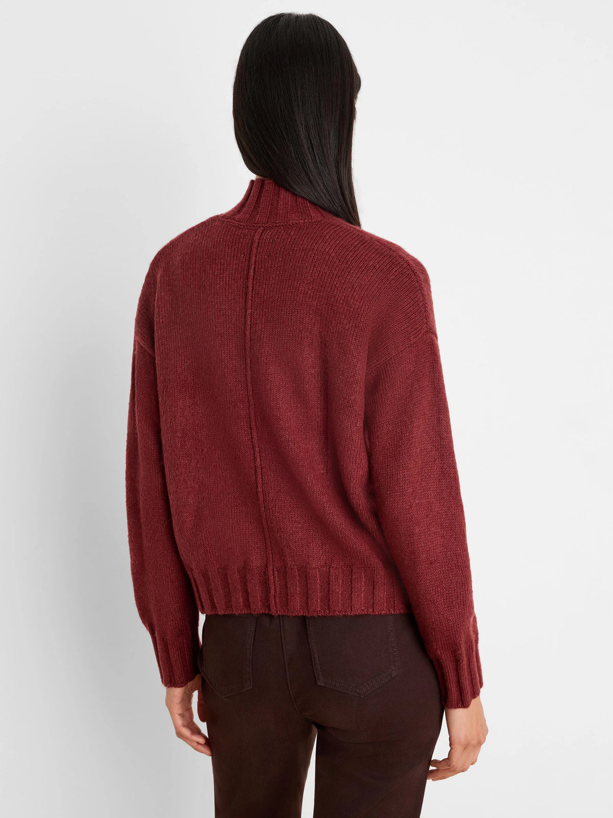 Dark burgundy knit cardigan, back view. Mock neck, center back seam, ribbed cuffs and hem.