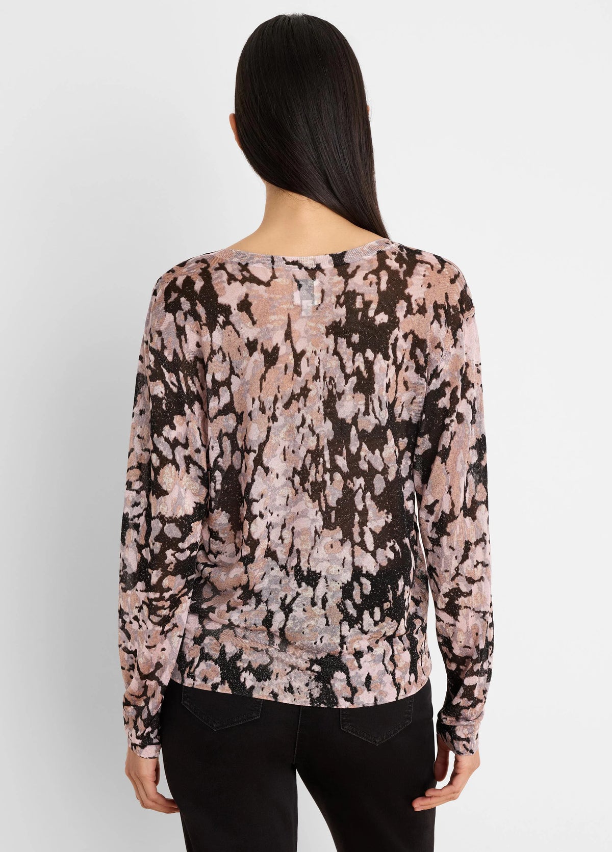 Back view of a long-sleeved sweater with an abstract pink, black, and beige mottled pattern, featuring subtle shimmer.