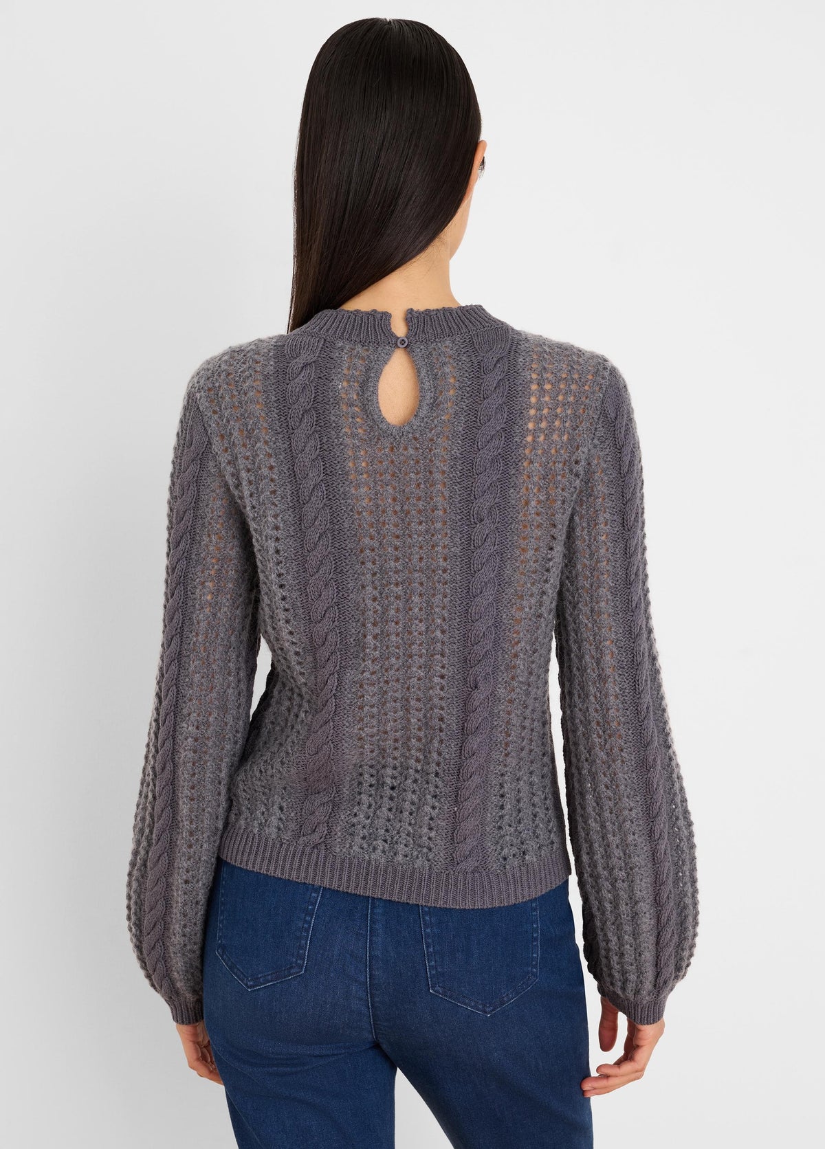 Grey sweater with mixed cable & openwork knits, keyhole button back, & puff sleeves.