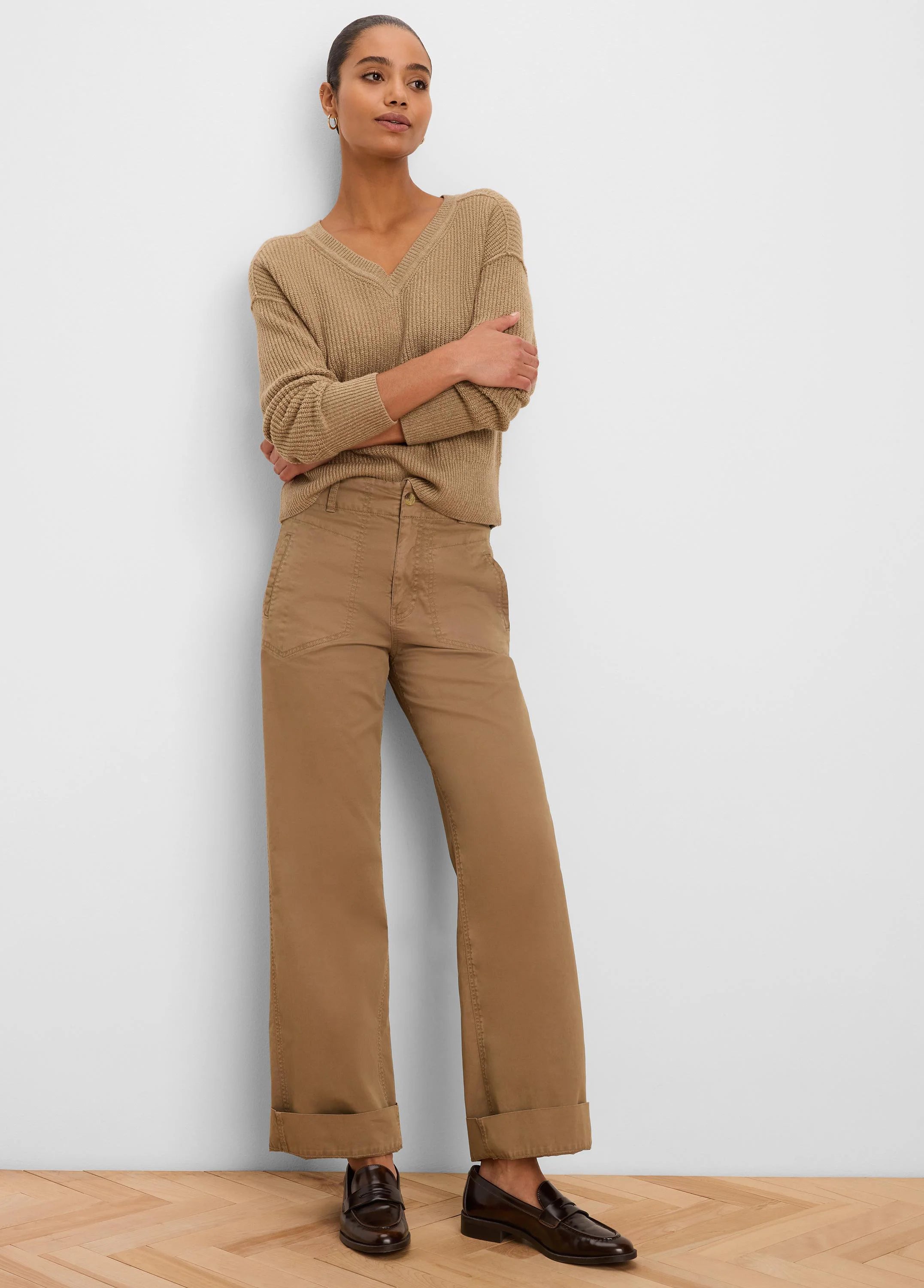 Tan, prominently ribbed V-neck pullover sweater.