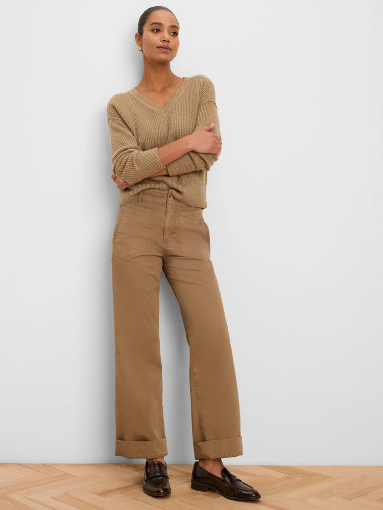 Tan, prominently ribbed V-neck pullover sweater.