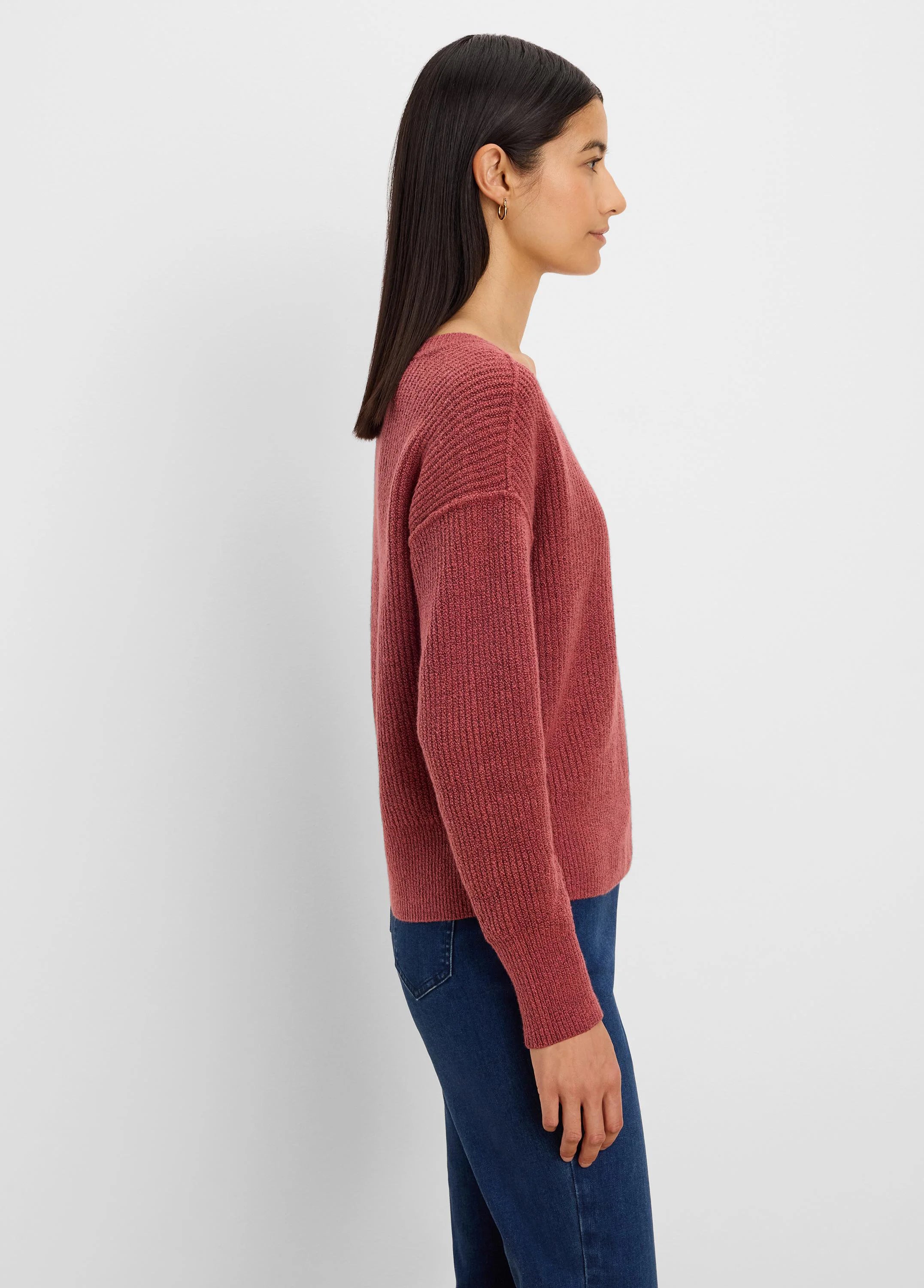 Muted red ribbed knit sweater with long sleeves and a relaxed fit.