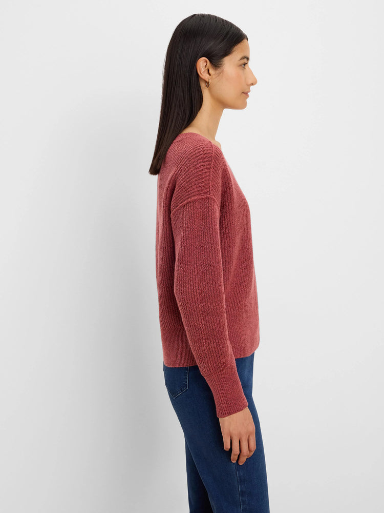 Muted red ribbed knit sweater with long sleeves and a relaxed fit.