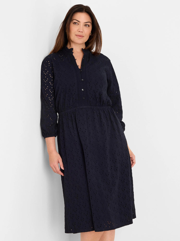 Navy eyelet midi dress featuring a stand collar, button placket, 3/4 sleeves, and elastic waist.