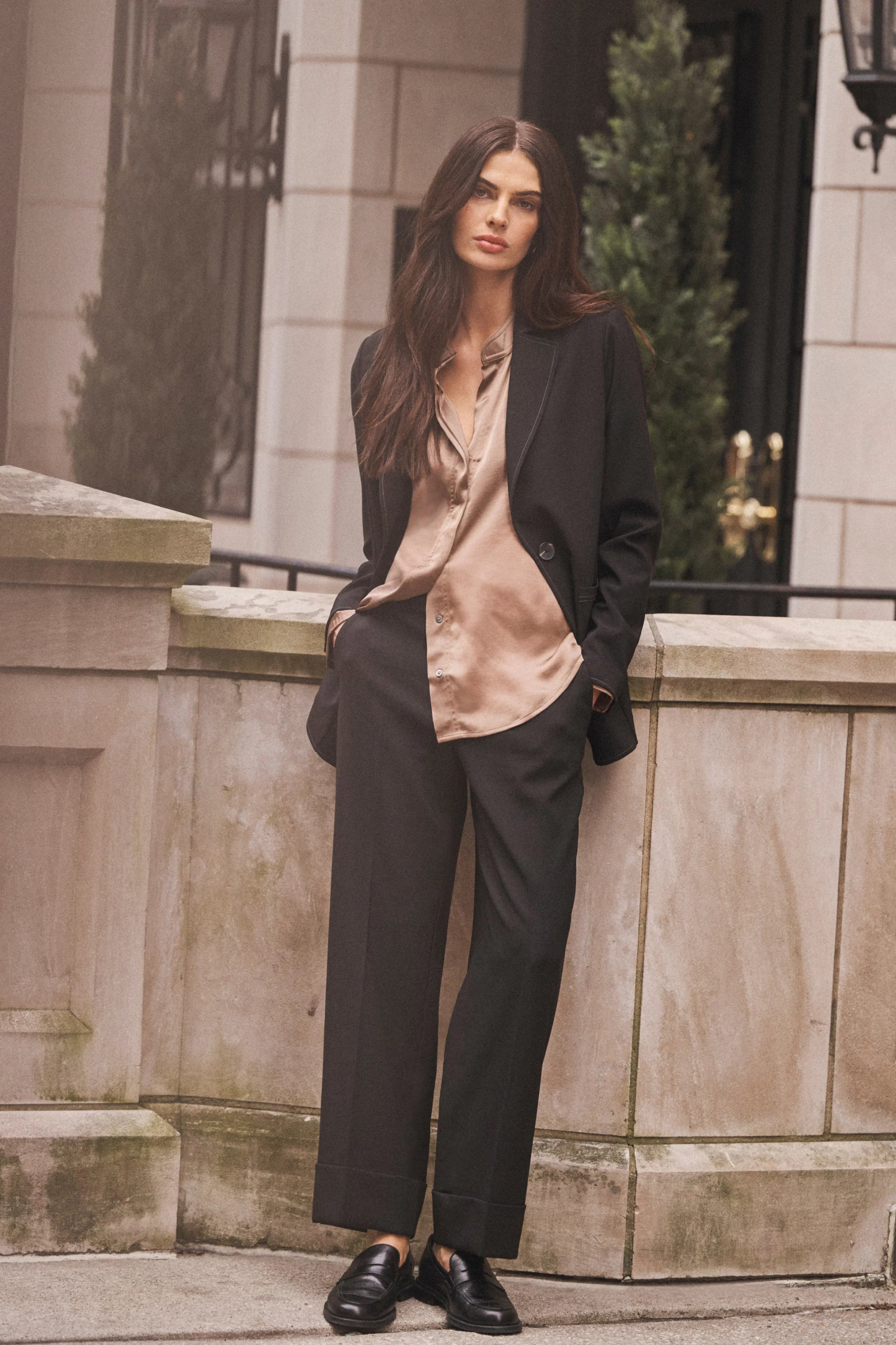 Black, straight-leg ankle pants with wide cuffs, worn by a model.