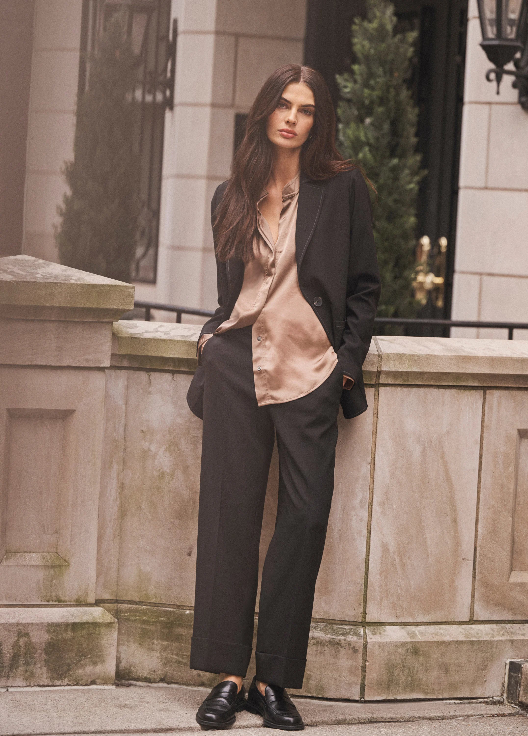 Black, straight-leg ankle pants with wide cuffs, worn by a model.