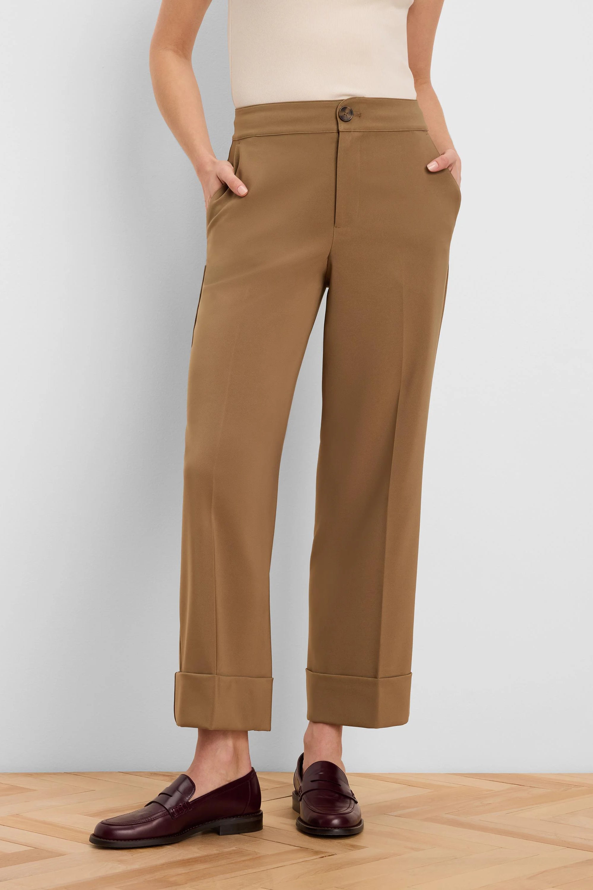 Camel brown ankle pants with wide cuffed hems, a front button closure, and side pockets.