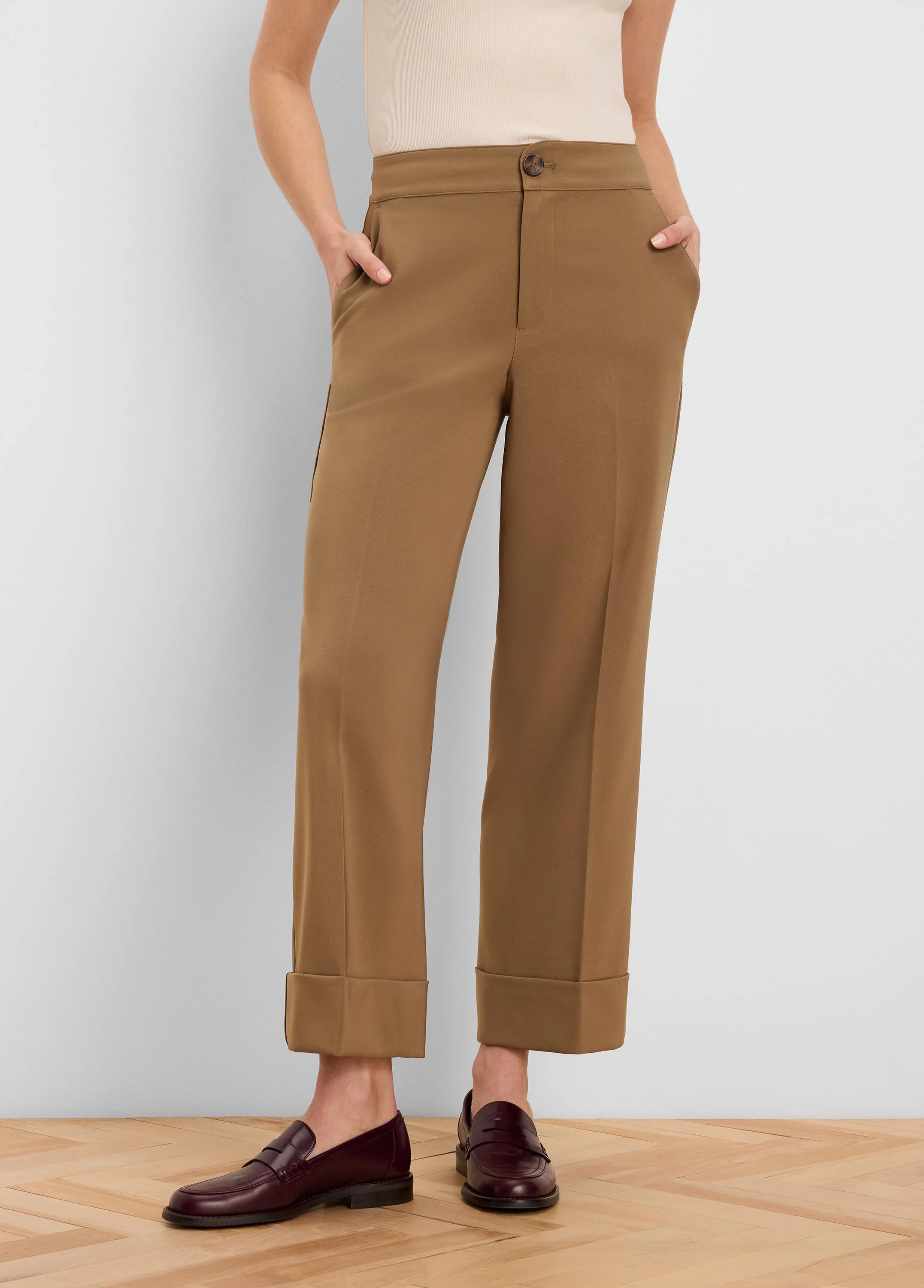 Camel brown ankle pants with wide cuffed hems, a front button closure, and side pockets.