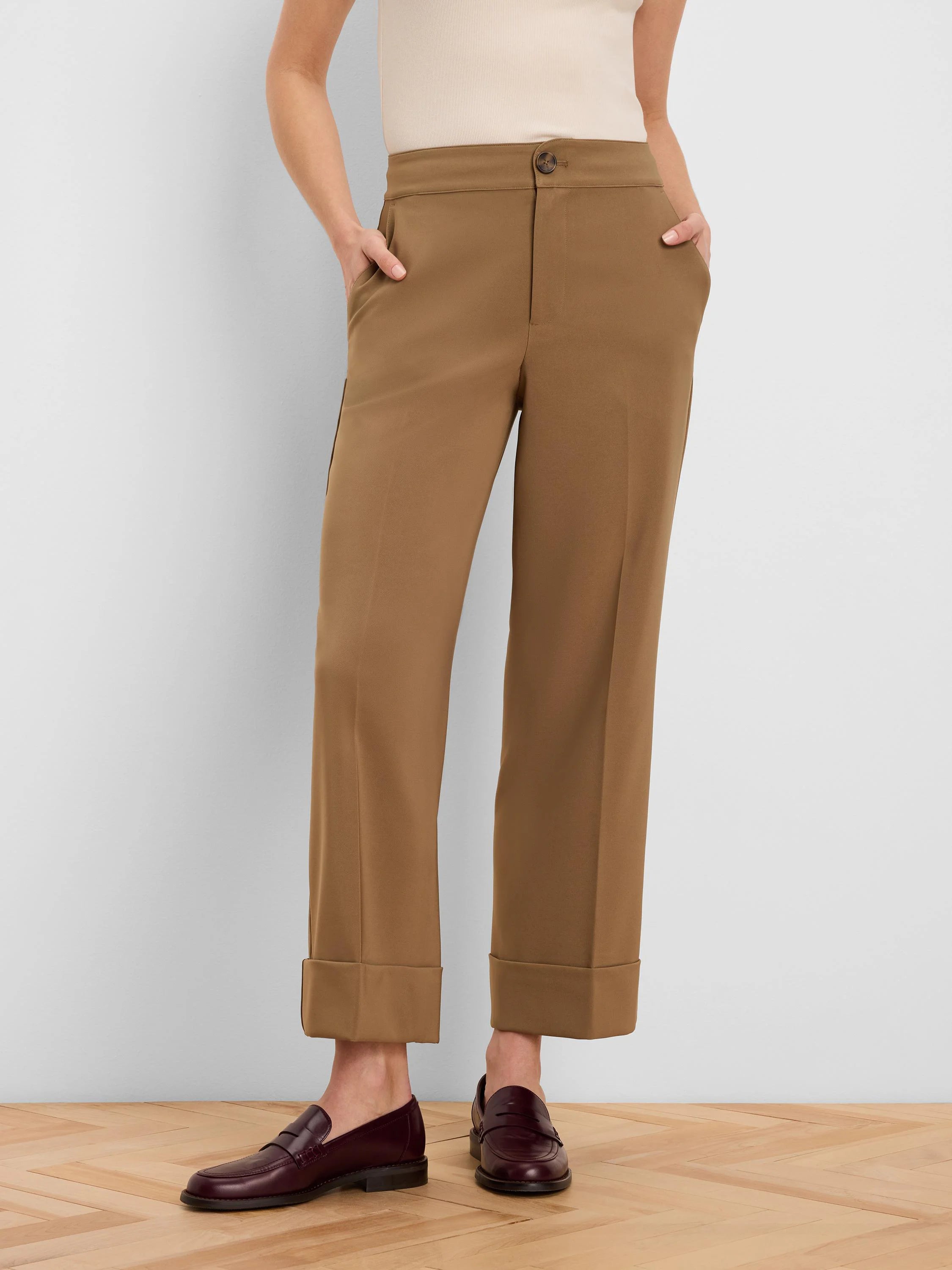 Camel brown ankle pants with wide cuffed hems, a front button closure, and side pockets.