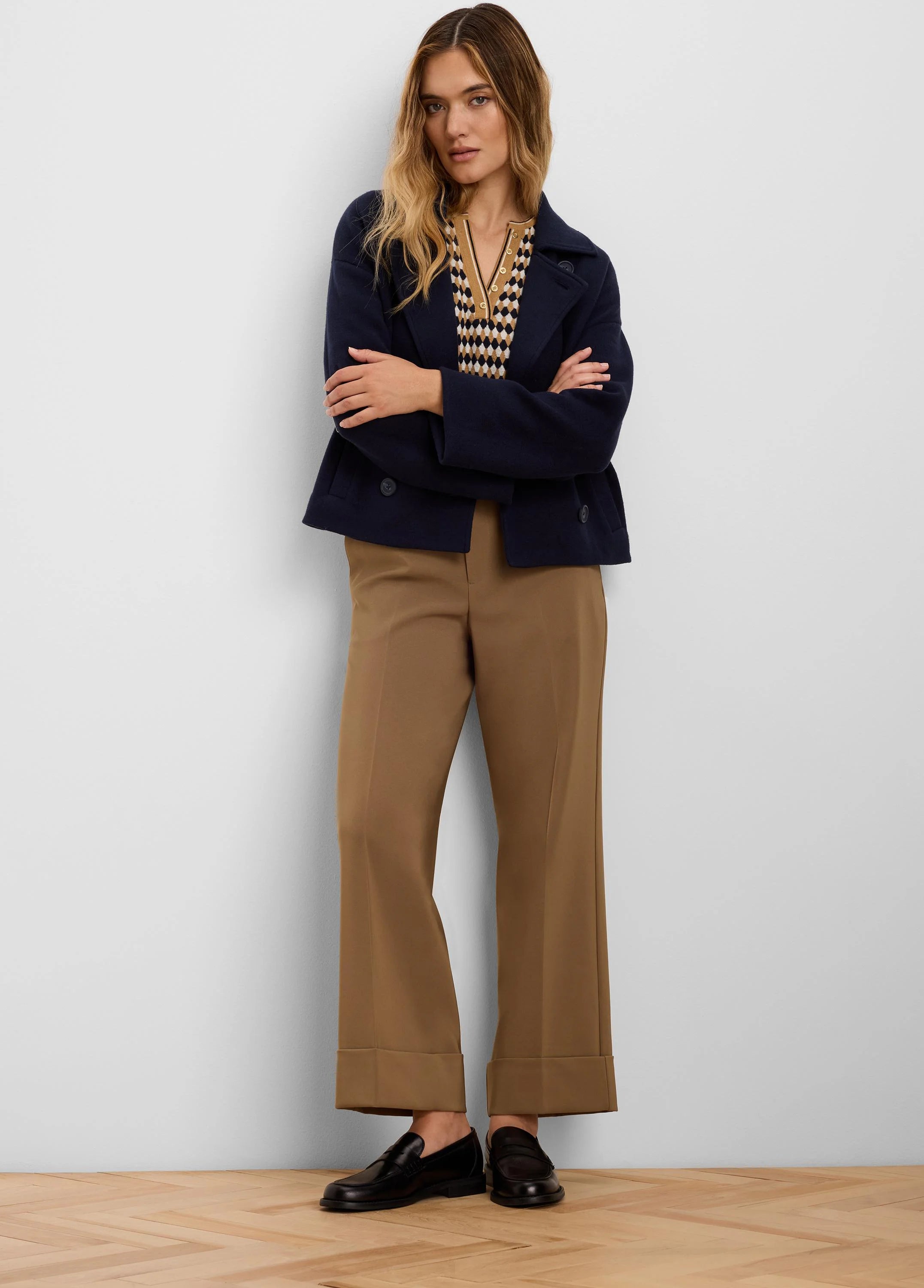 Camel brown wide-leg pants with deep cuffed ankles.
