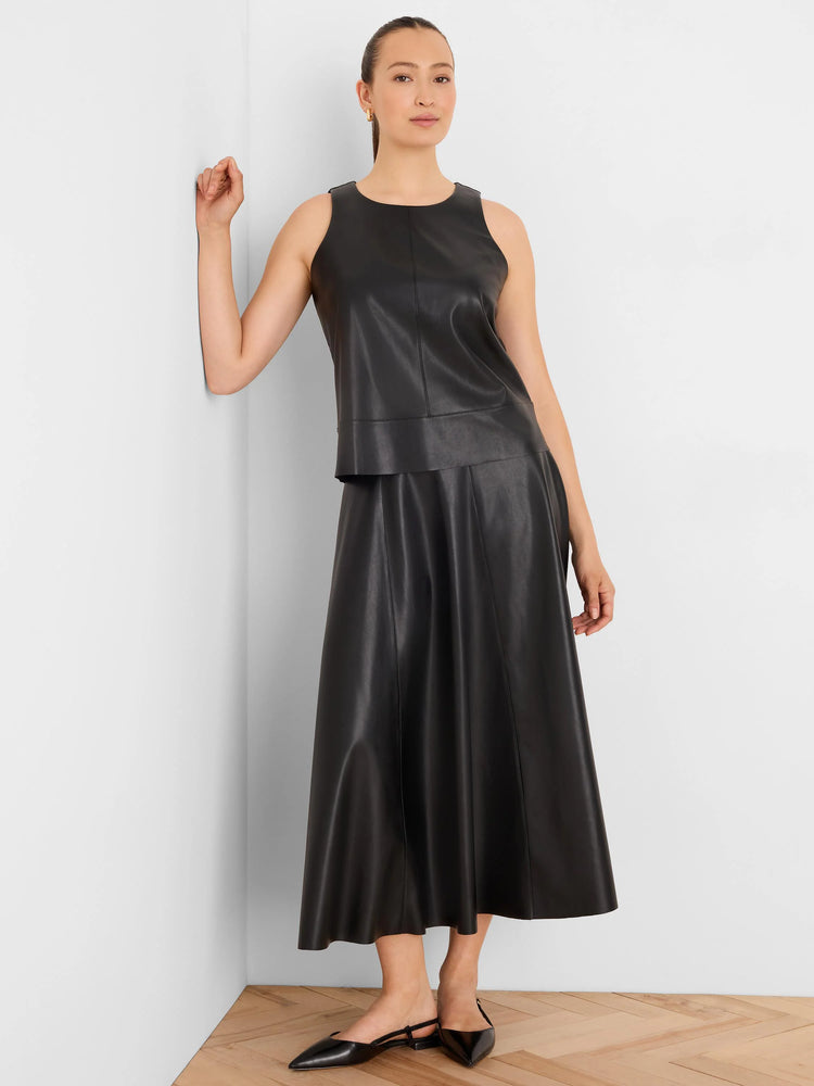 Black vegan leather A-line midi skirt with visible vertical seams.