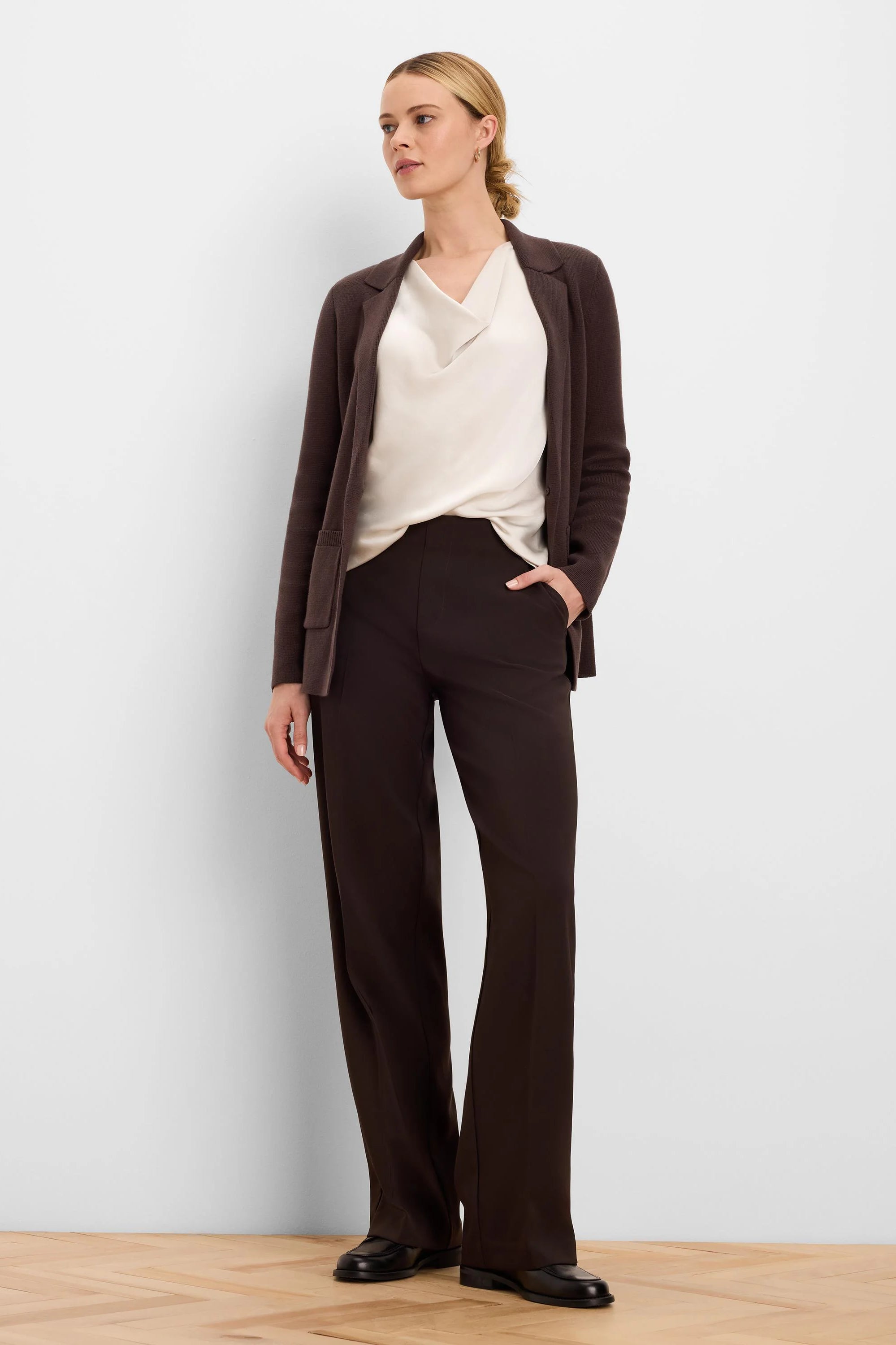 Dark brown, full-length wide-leg pants with a sleek, smooth texture.
