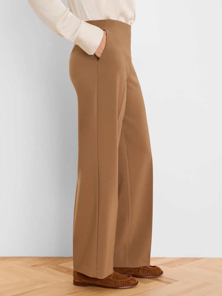 High-waisted, wide-leg camel brown pants with side pockets. Appears sleek and smooth.