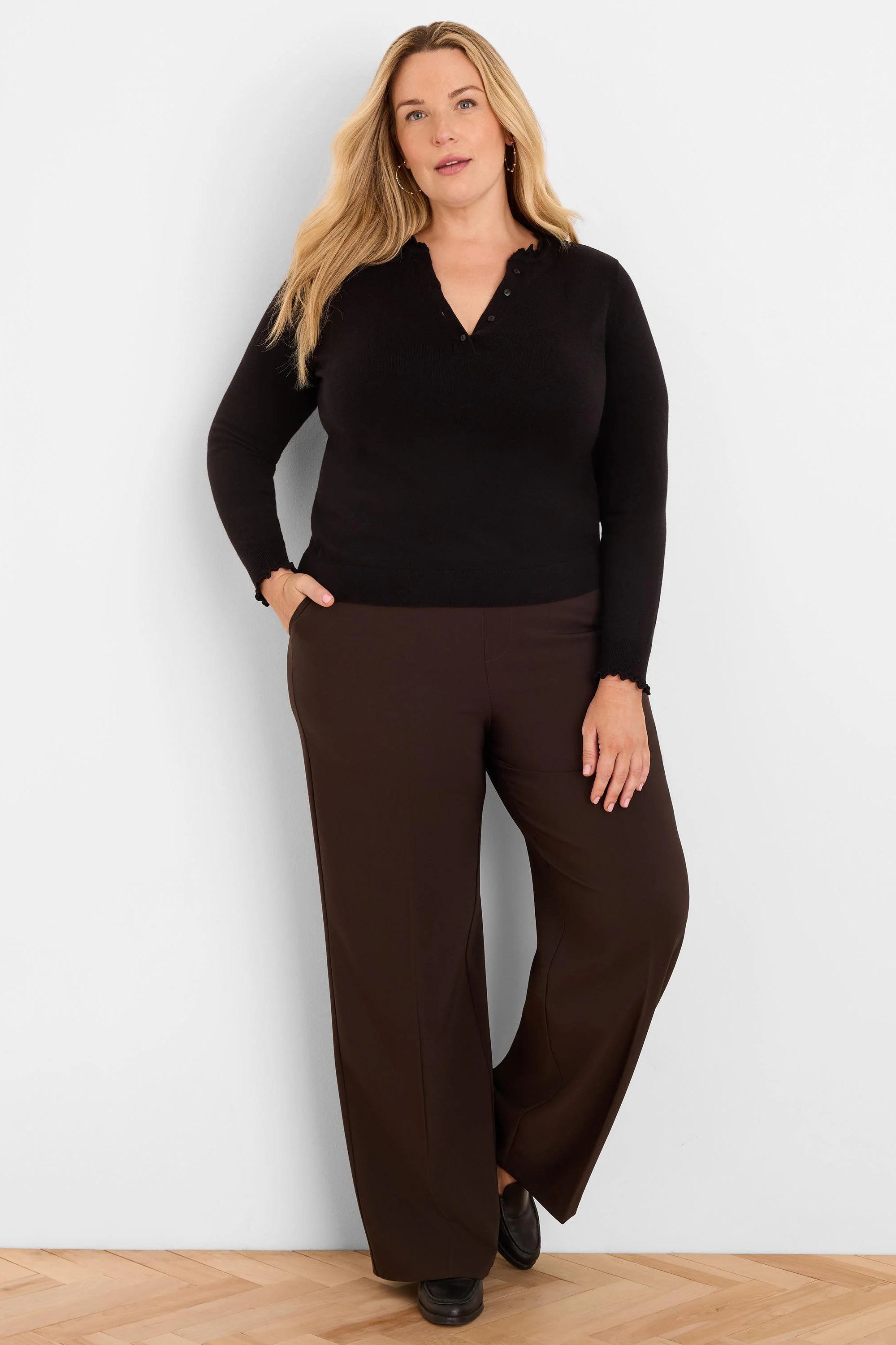 Dark brown, full-length wide-leg pants with a sleek, smooth finish.