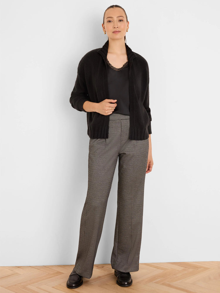 Black lace-trim tank top with subtle sheen, worn under a black cardigan.