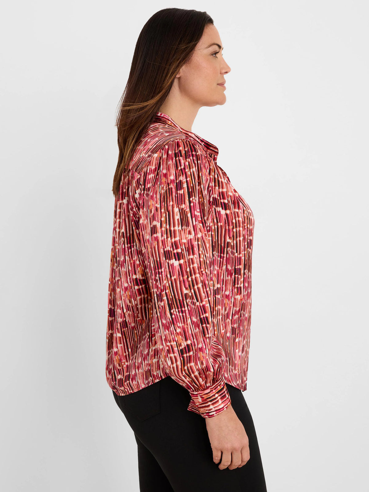 Red, orange, black abstract stripe pleated shirt. Collared, long sleeves.