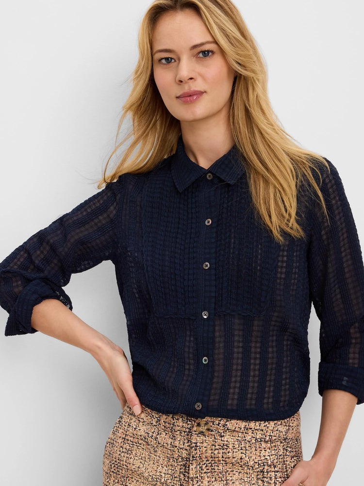 Dark blue sheer chiffon jacquard shirt features a crinkled grid texture, button-front, and collar.