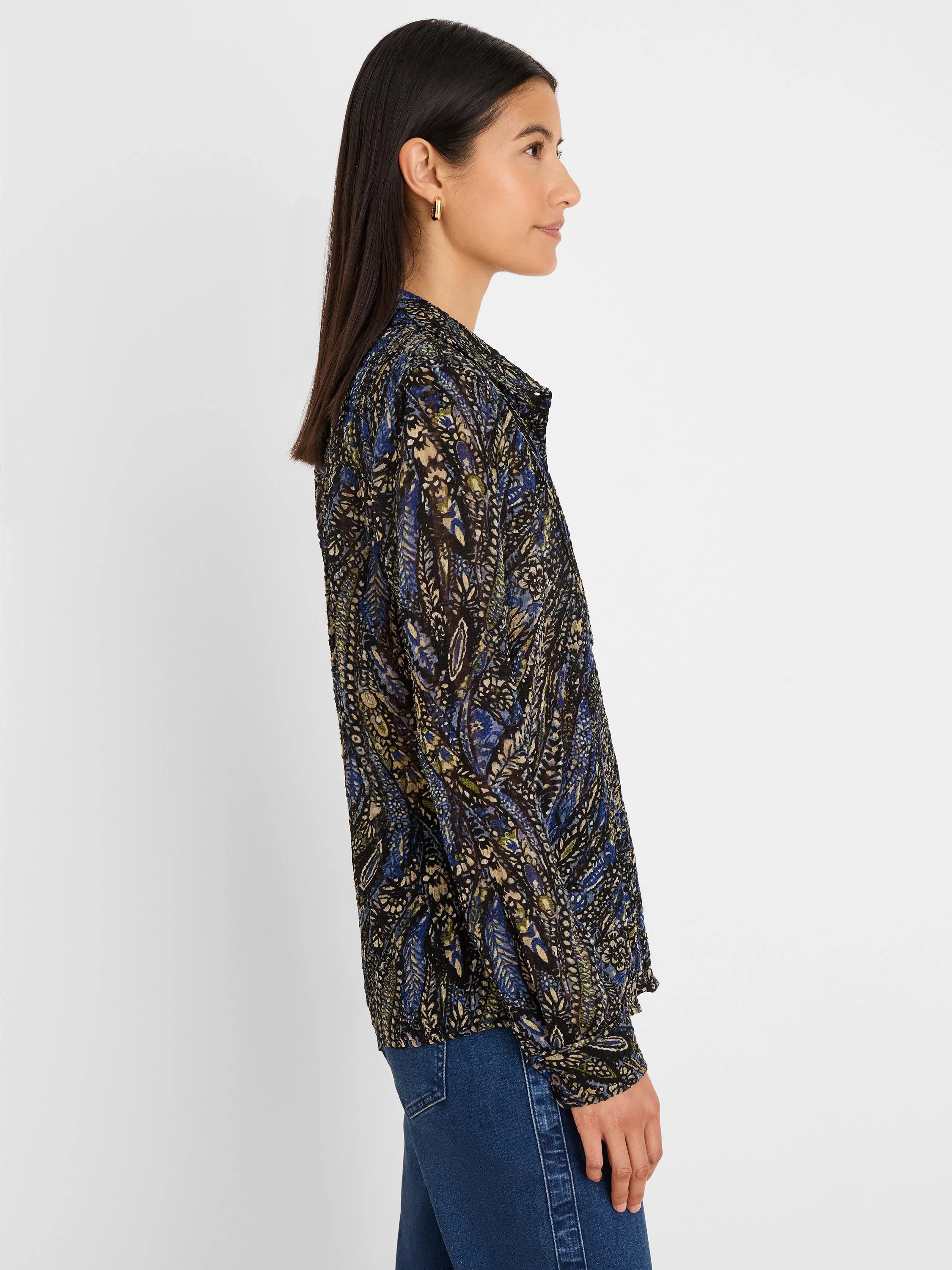 Dark chiffon shirt with blue, beige, and green paisley pattern. Collared, long-sleeved.