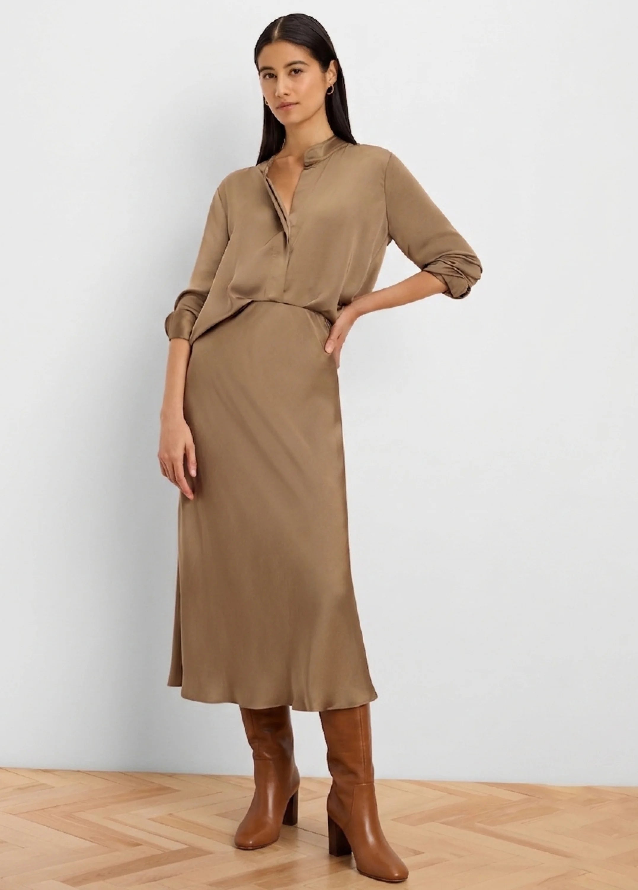 Warm brown glossy midi-length slip skirt.