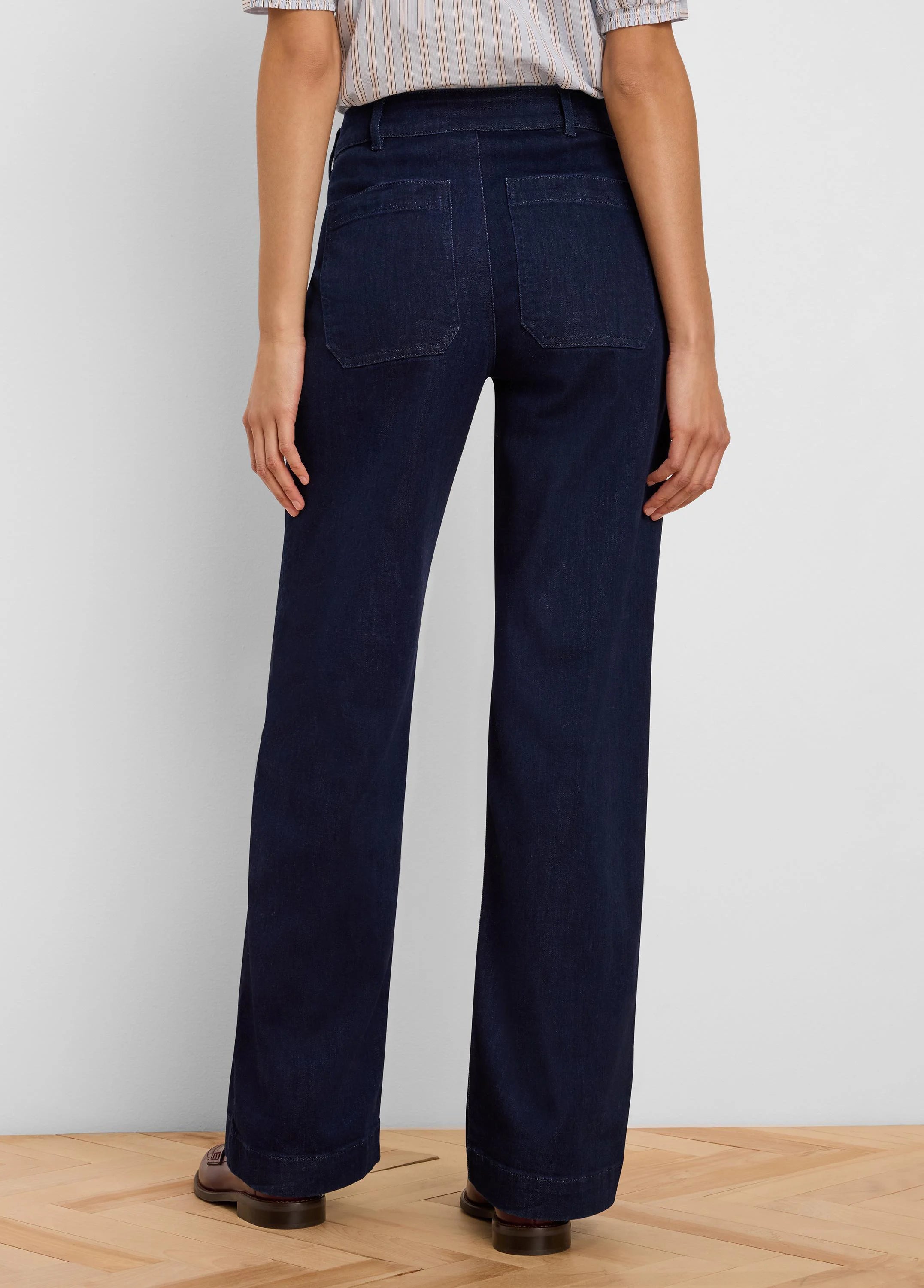 Dark blue wide leg jeans, shown from back, with two rectangular patch pockets on the rear.